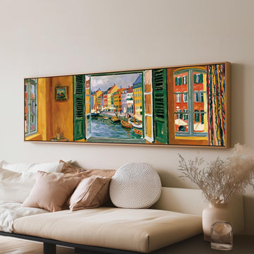 Copenhagen's colorful canal through a window long horizontal canvas print above a sofa in a living room