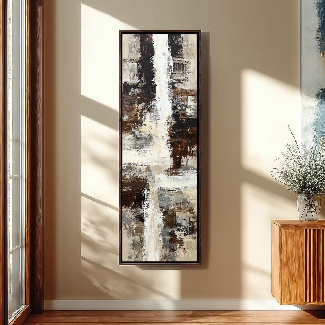 a large abstract painting hanging on a wall in a room with wooden furniture and a window.