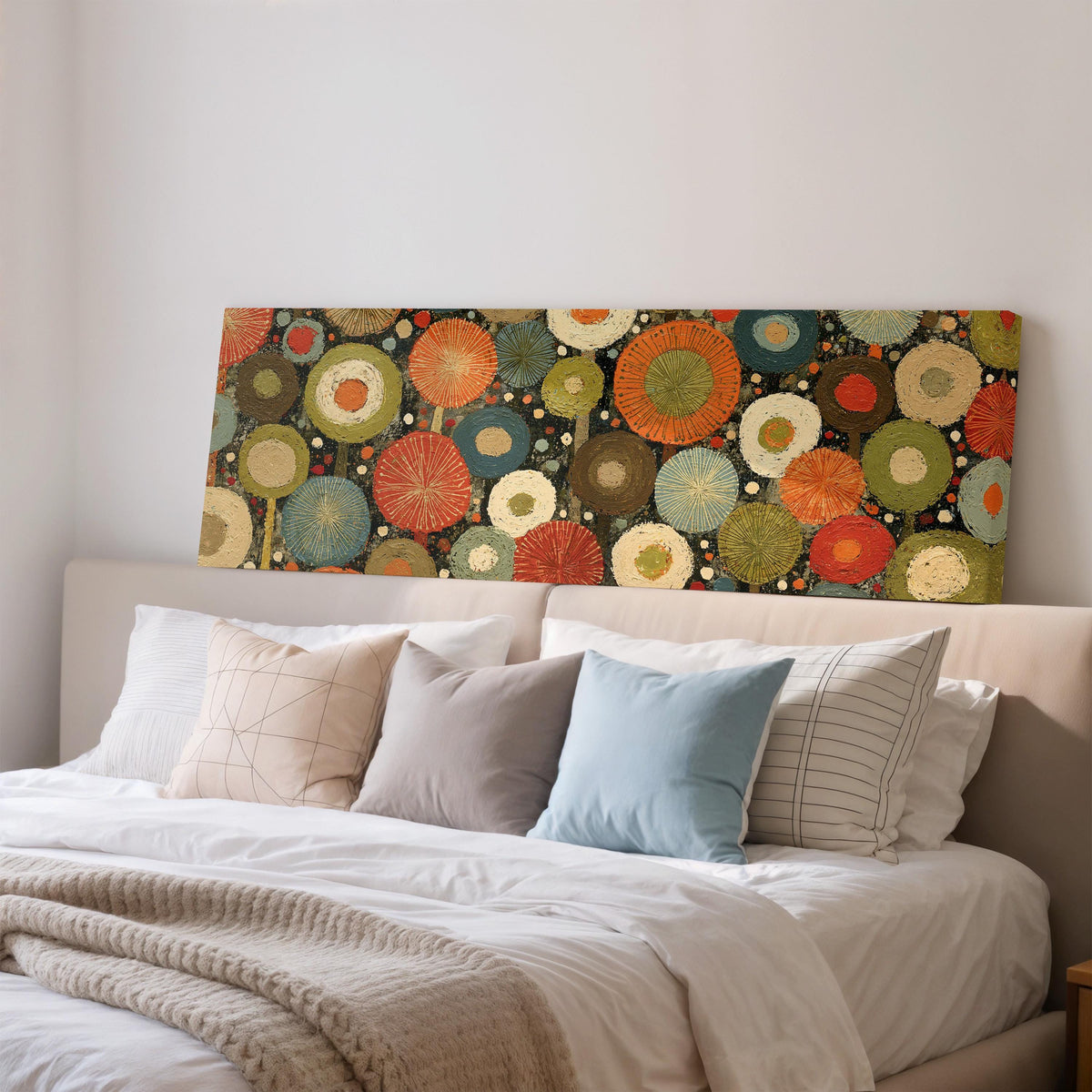 Layered circle dot pattern wide panoramic canvas print above a bed in a bedroom