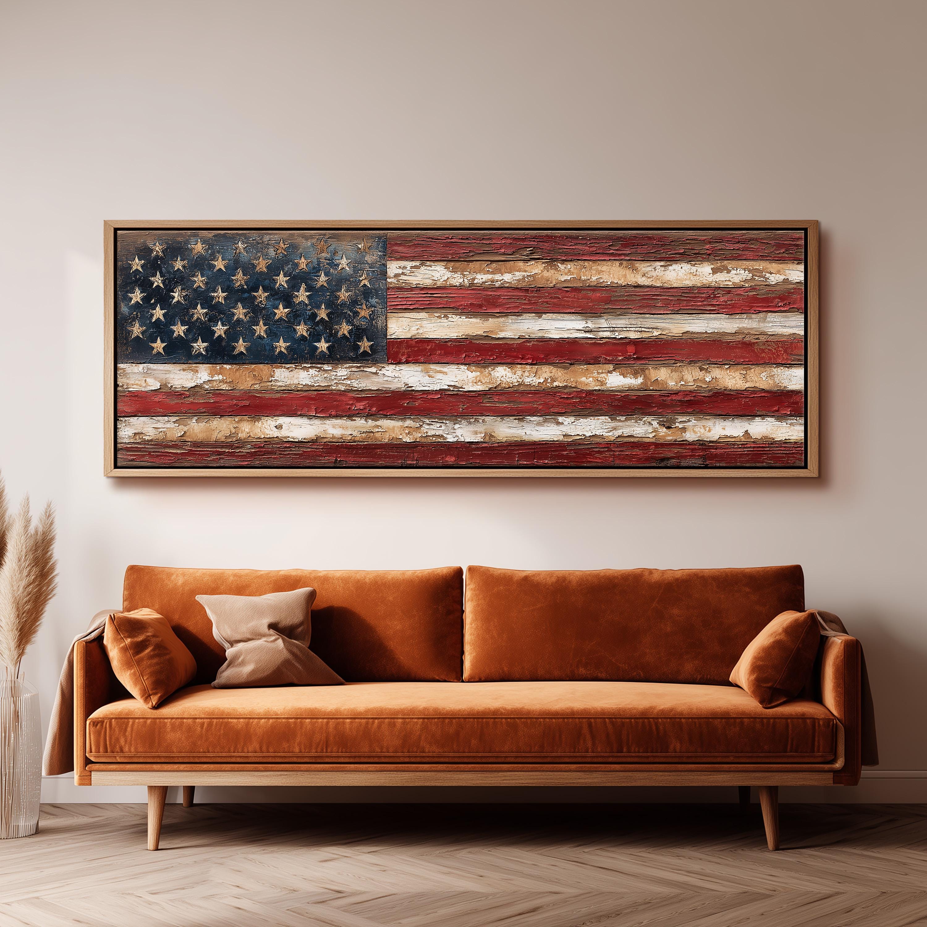 a large, rust-colored sofa with a framed American flag artwork hanging above it on a wall.