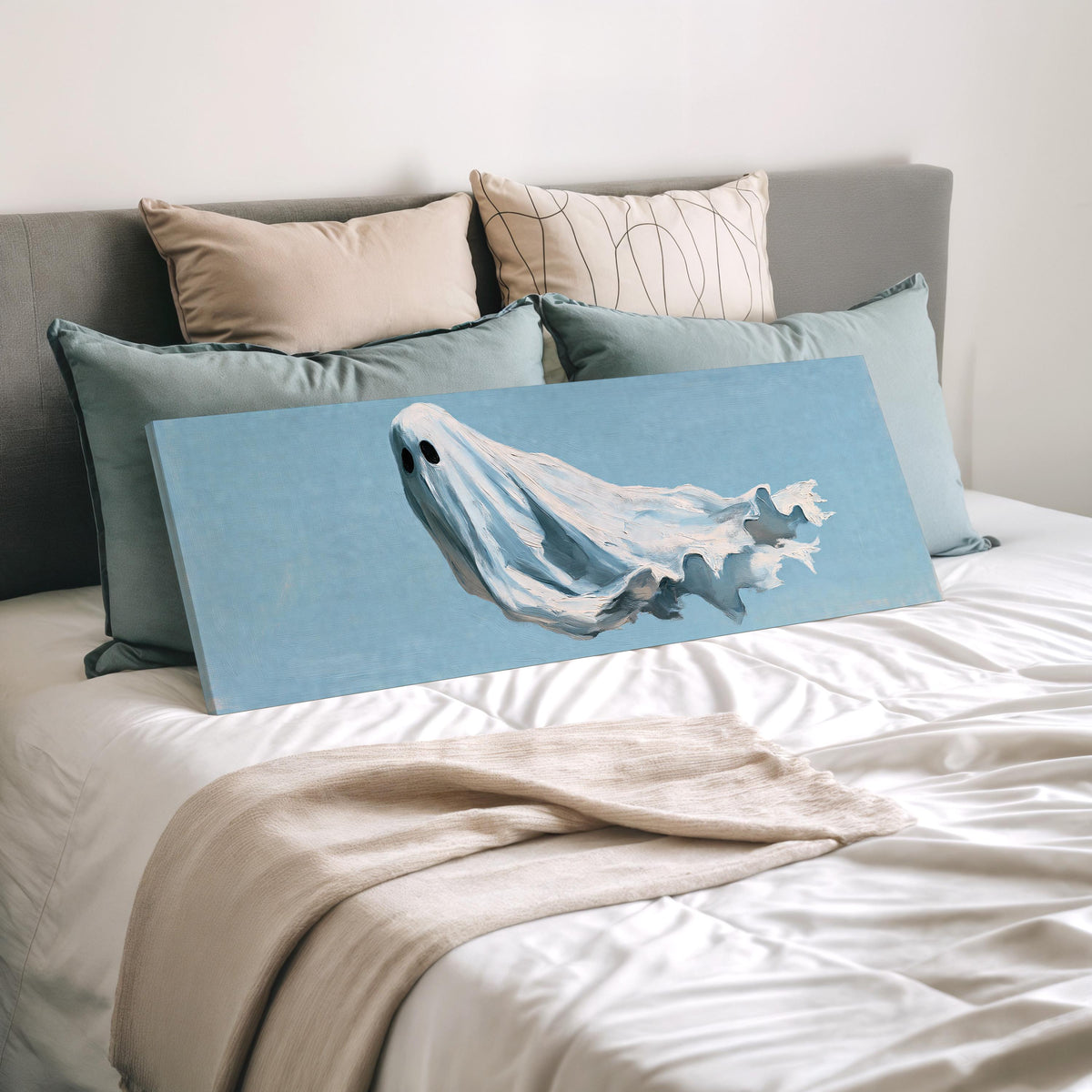 Drifting ghost spirit wide panoramic canvas print laid on a bed to show its size