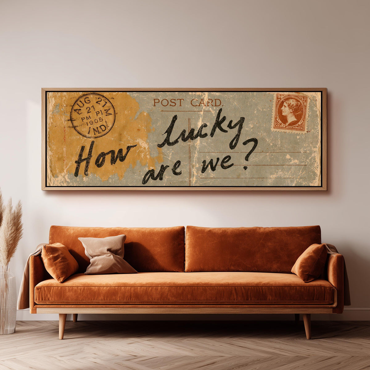 Vintage postcard saying how lucky are we panoramic canvas print above a sofa in a living room