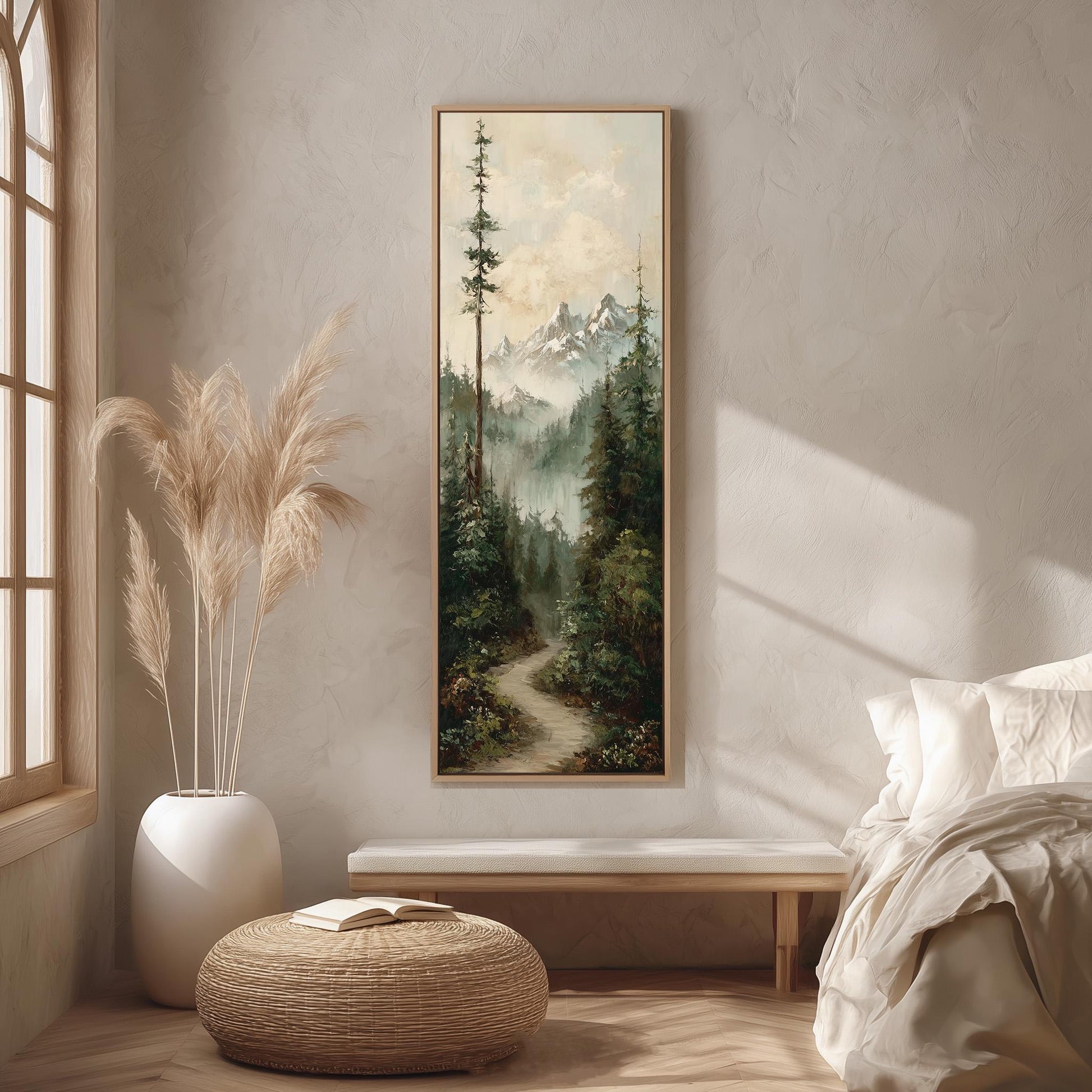 a serene bedroom scene with a large painting of a forest landscape hanging on the wall, a white bed with a white pillow, a white vase with tall potted plants, and a woven ottoman in front of the bed.