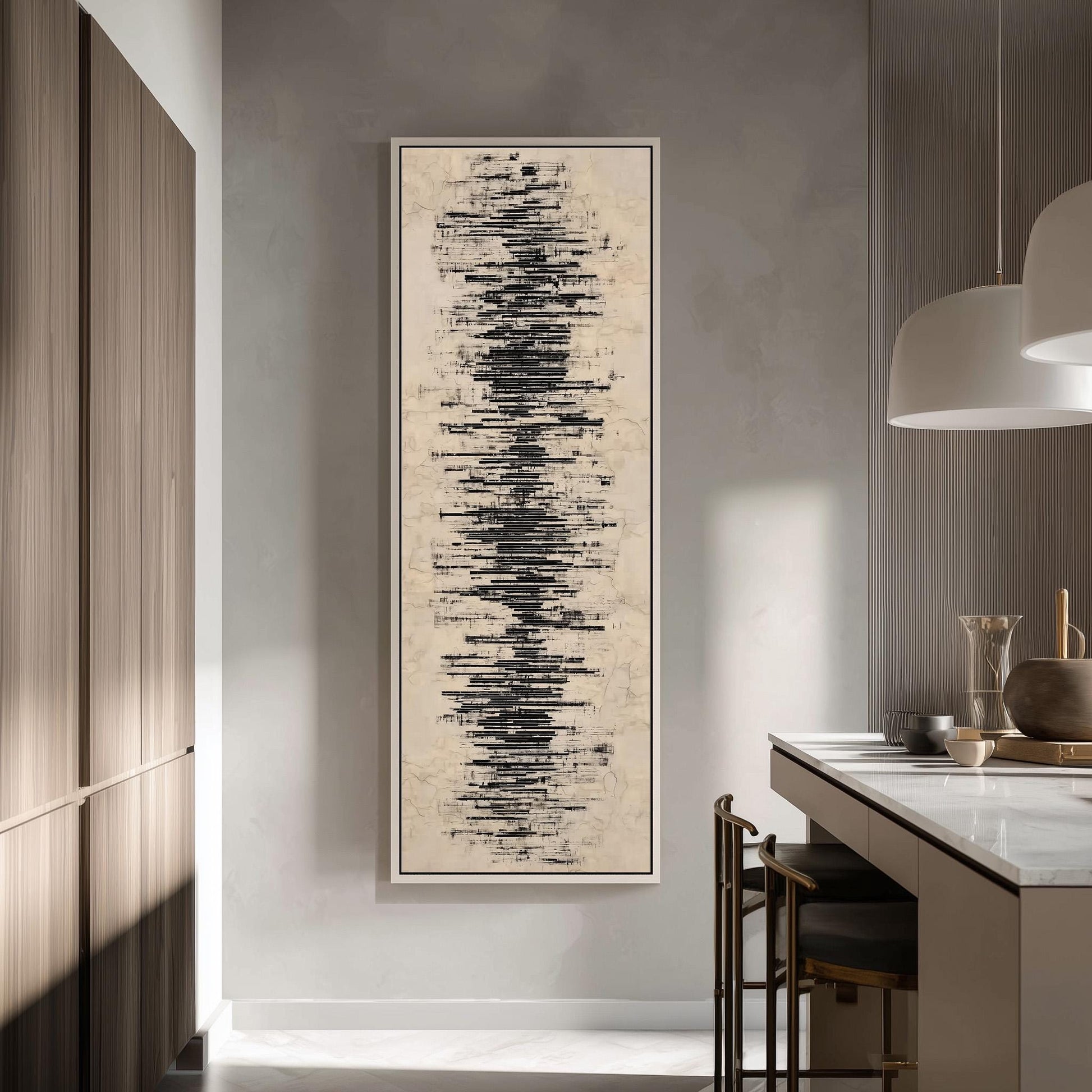 a modern kitchen with a large abstract painting hanging on the wall. The painting has a black and white color scheme and appears to depict a wave-like pattern. The kitchen is well-lit, with a countertop and chairs visible, creating a stylish and contemporary atmosphere.