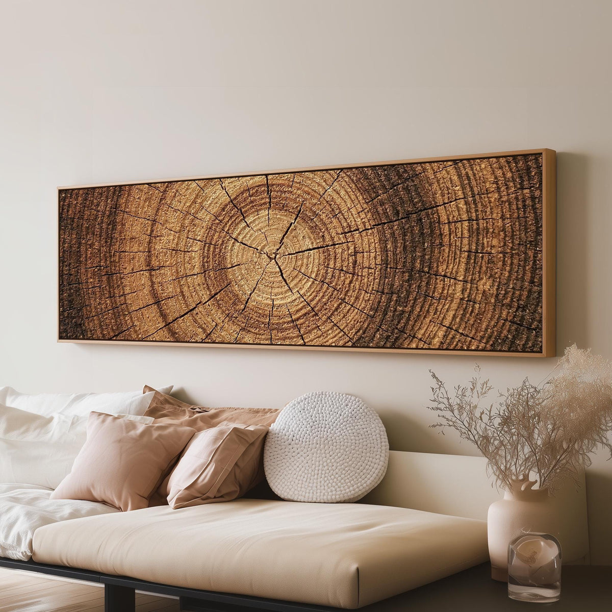 Warm oak wood ring long horizontal canvas print above a sofa in a living room