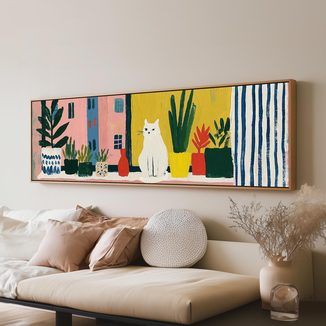 White cat on a sunny balcony with plants long horizontal canvas print above a sofa in a living room