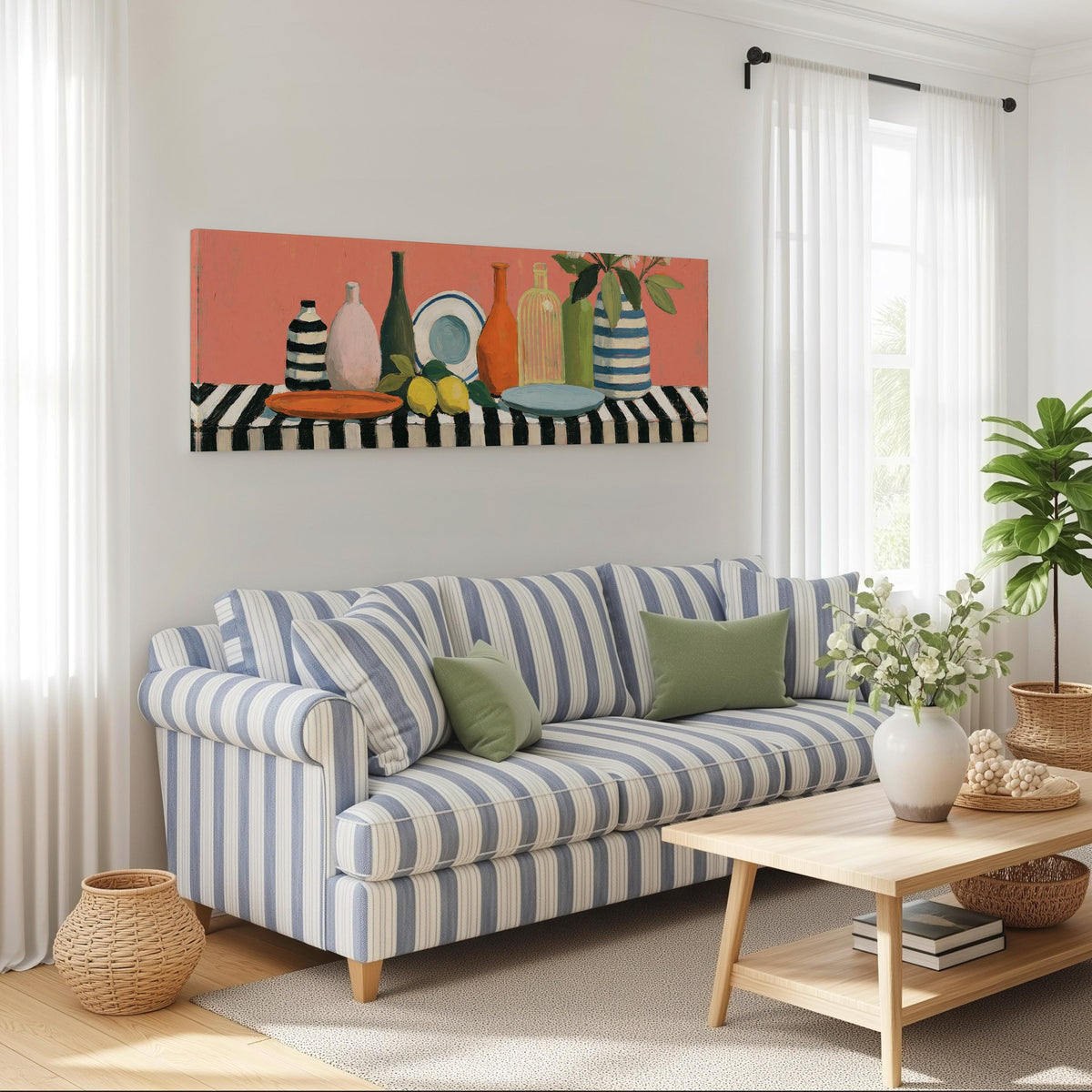 Bottles and lemons still life long horizontal canvas print above a striped sofa in a coastal living room