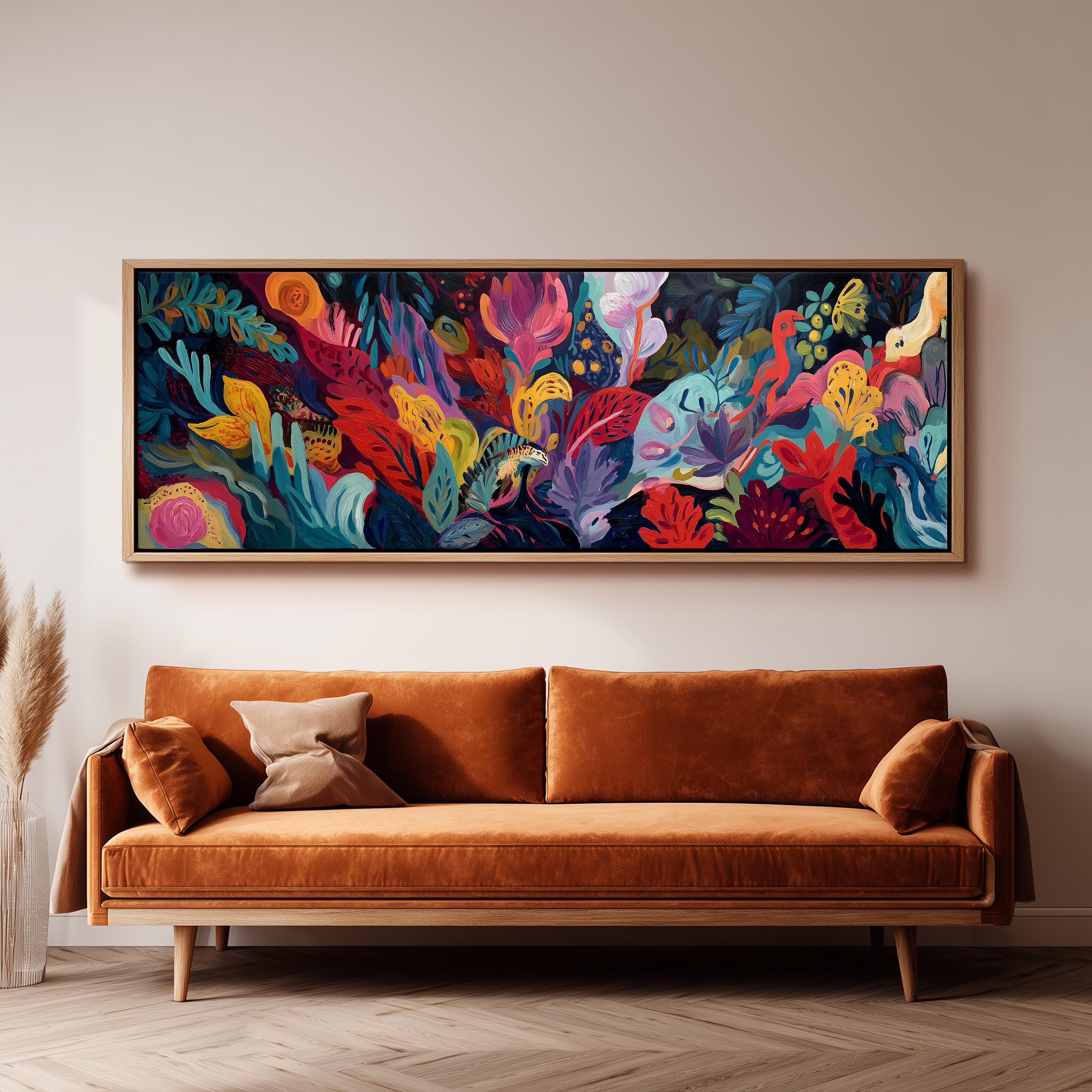 a large, colorful painting of a tropical garden hanging on a wall above a brown sofa.