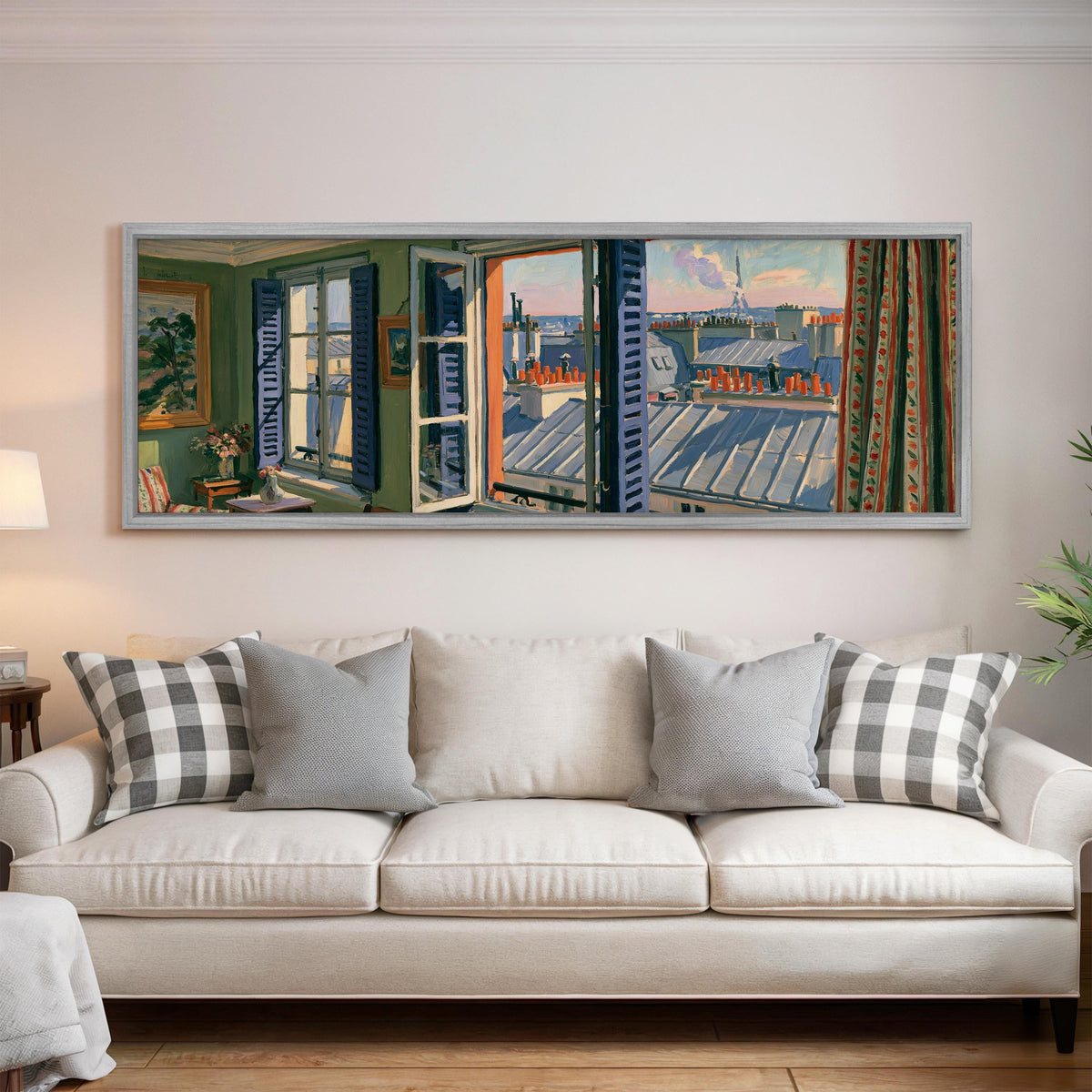 Paris chimneys and rooftops from a sunny window panoramic canvas print above a white sofa in a bright living room