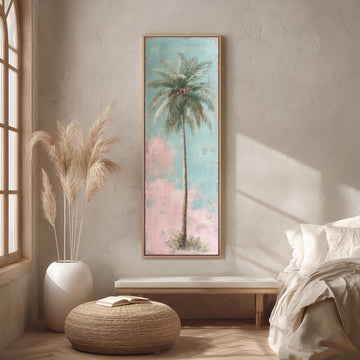 a serene bedroom scene with a large framed painting of a palm tree hanging on the wall, a white bed with a white pillow, a white vase with tall potted plants, and a woven ottoman in front of the bed.