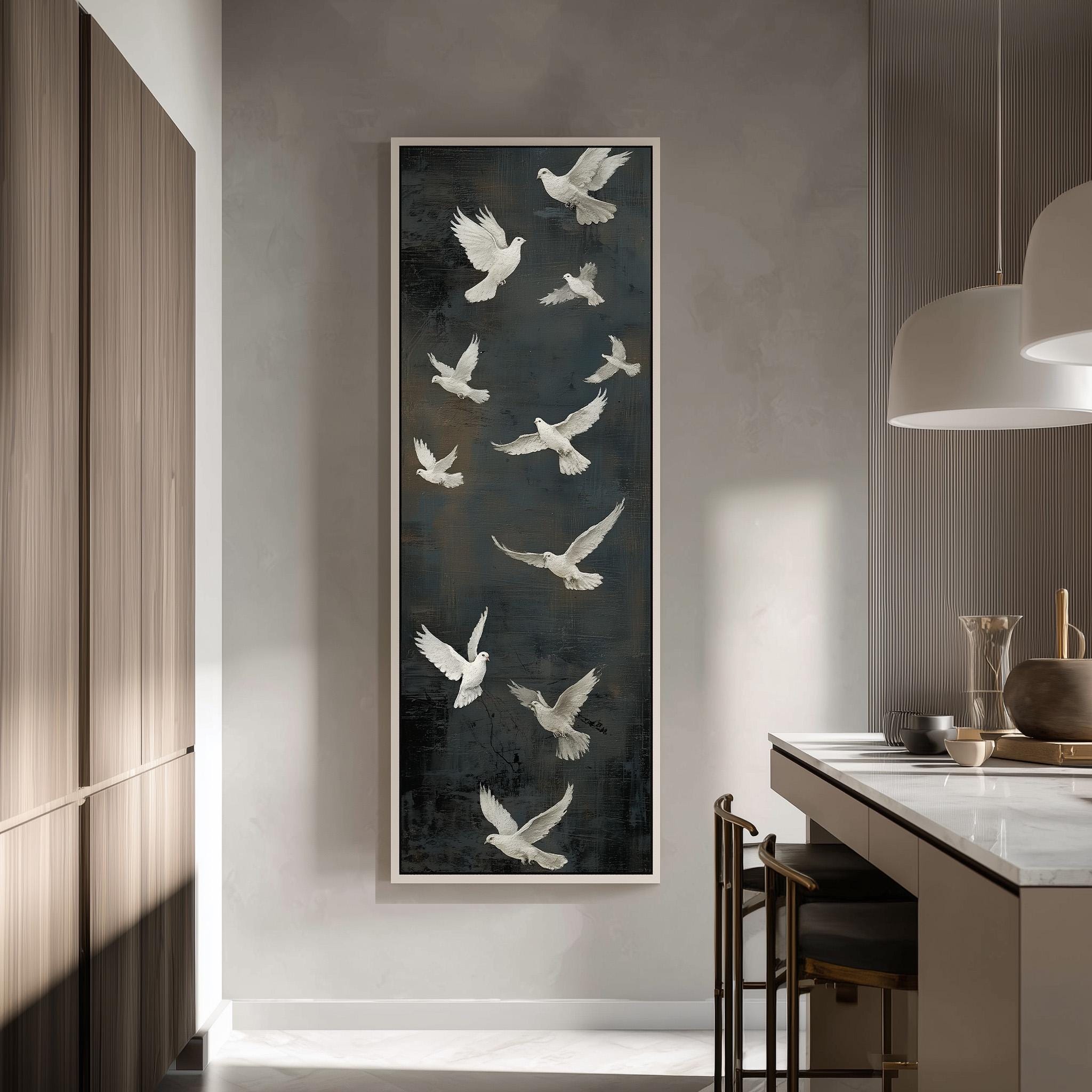 a large framed painting of white birds in flight, hanging on a wall in a modern kitchen.