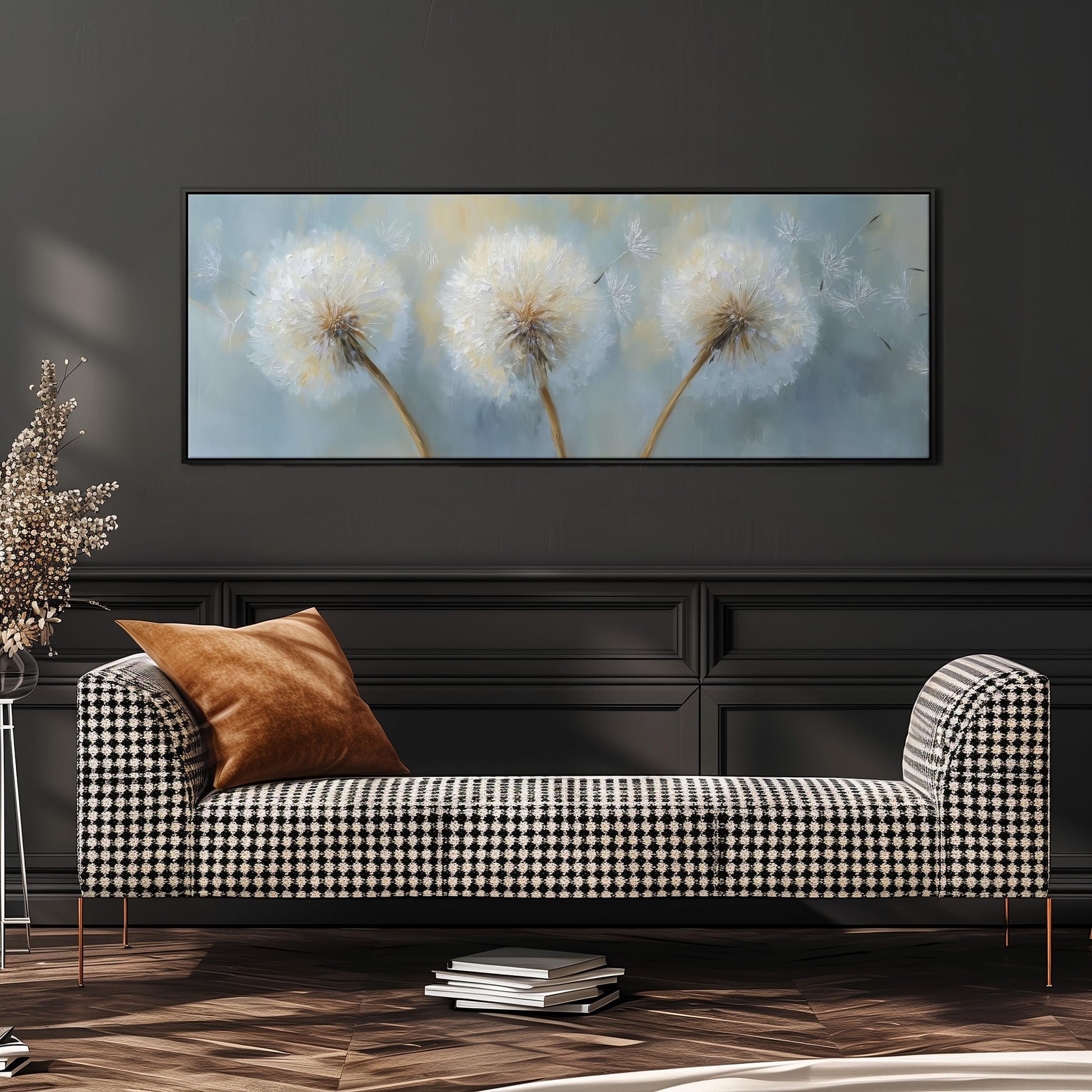 a black and white checkered sofa with a brown throw pillow, set against a dark wall with a large framed painting of dandelions above it.