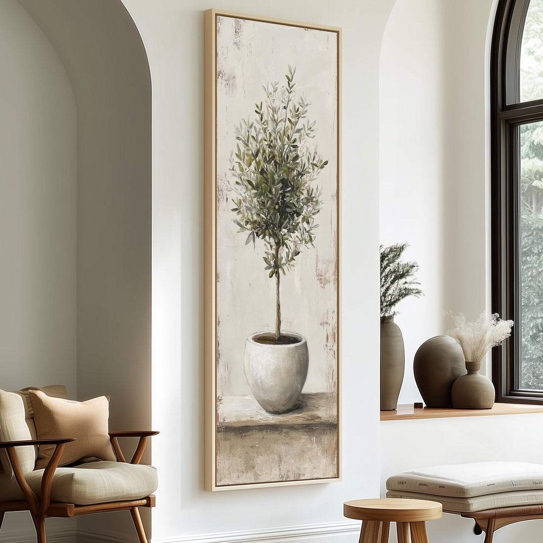 a large painting of a potted plant hanging on a wall, with a wooden chair and a small table in the foreground.