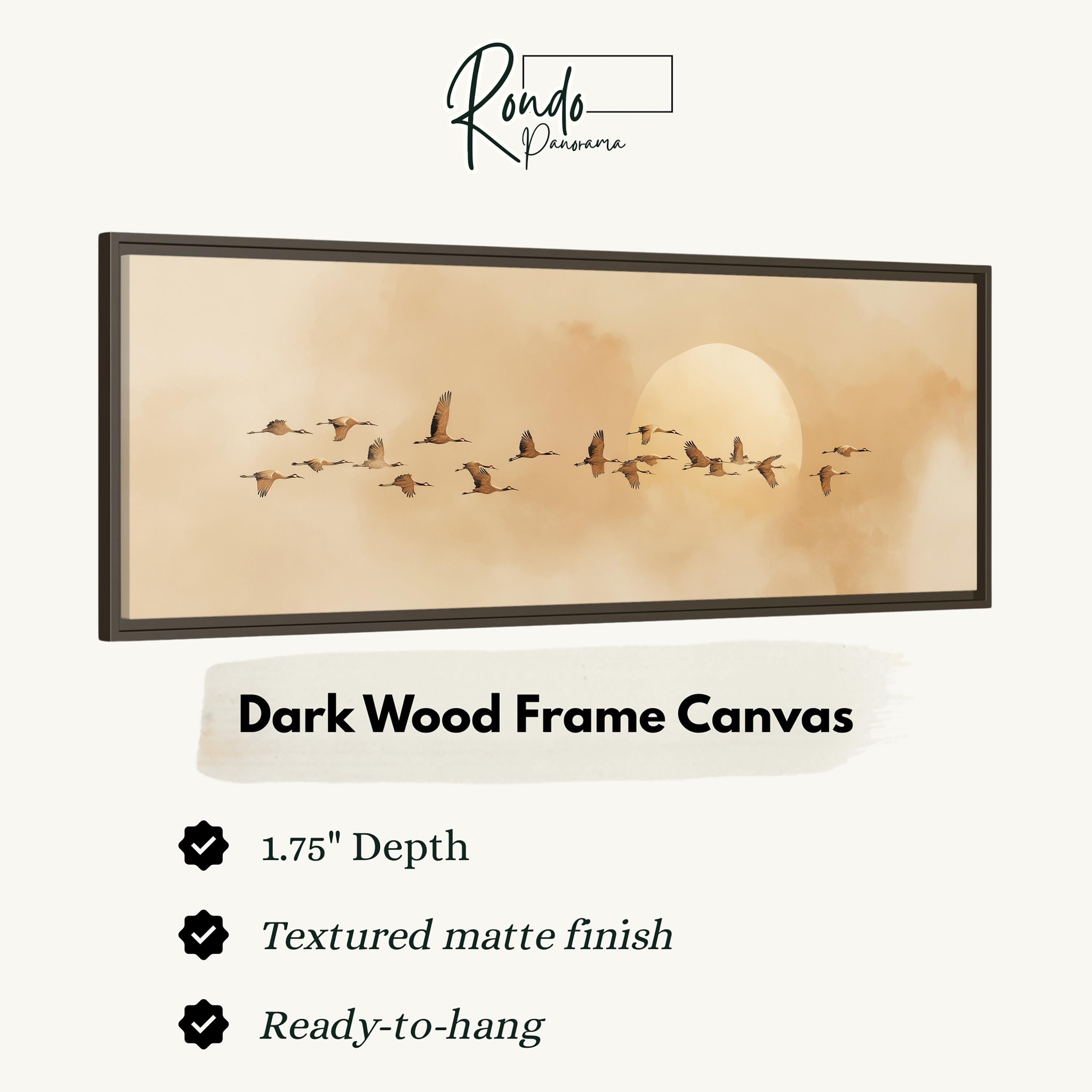 a dark wood frame canvas depicting a flock of birds flying in the sky.