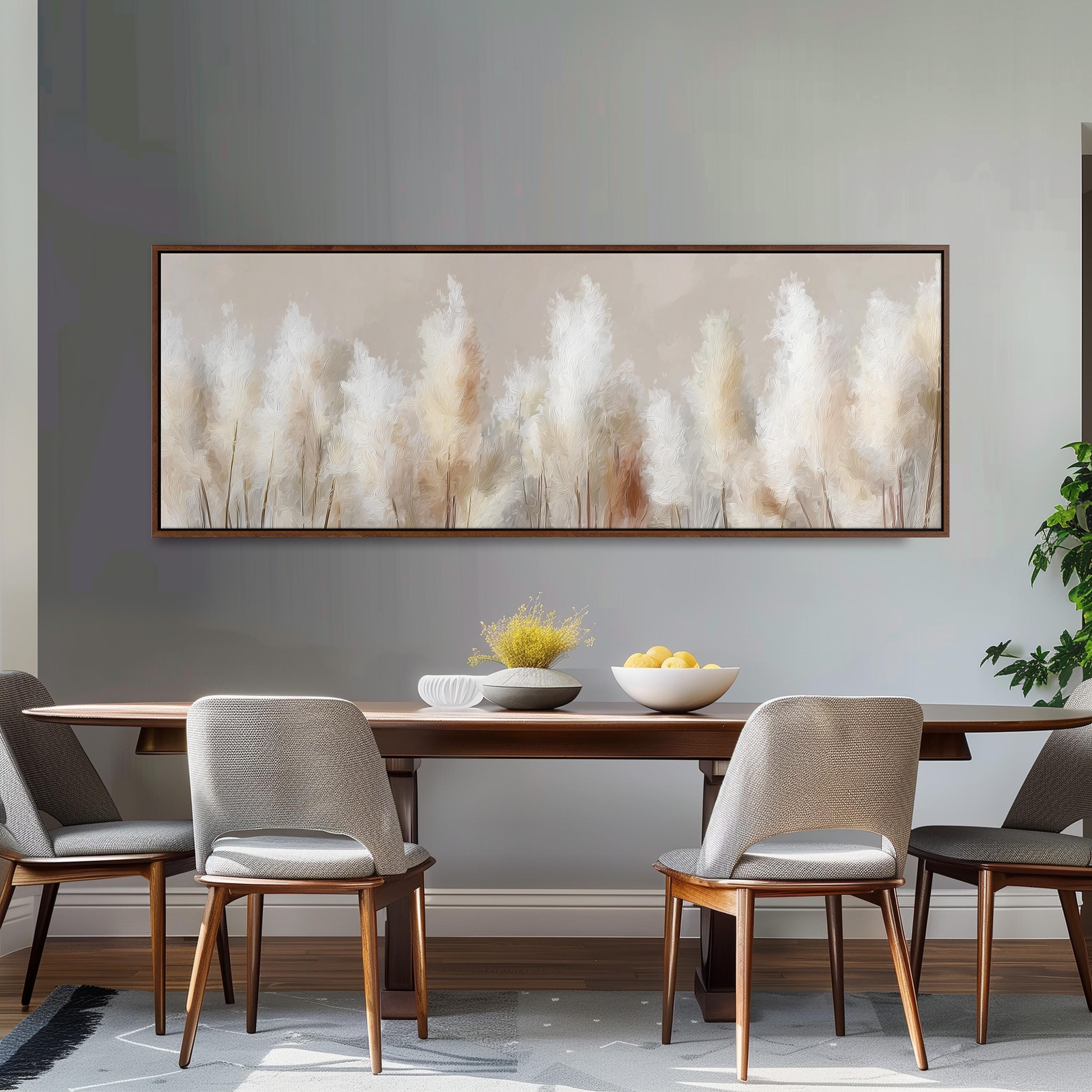 a dining room with a wooden table and four chairs, a large painting of white flowers hanging on the wall above the table, and a bowl of fruit on the table.