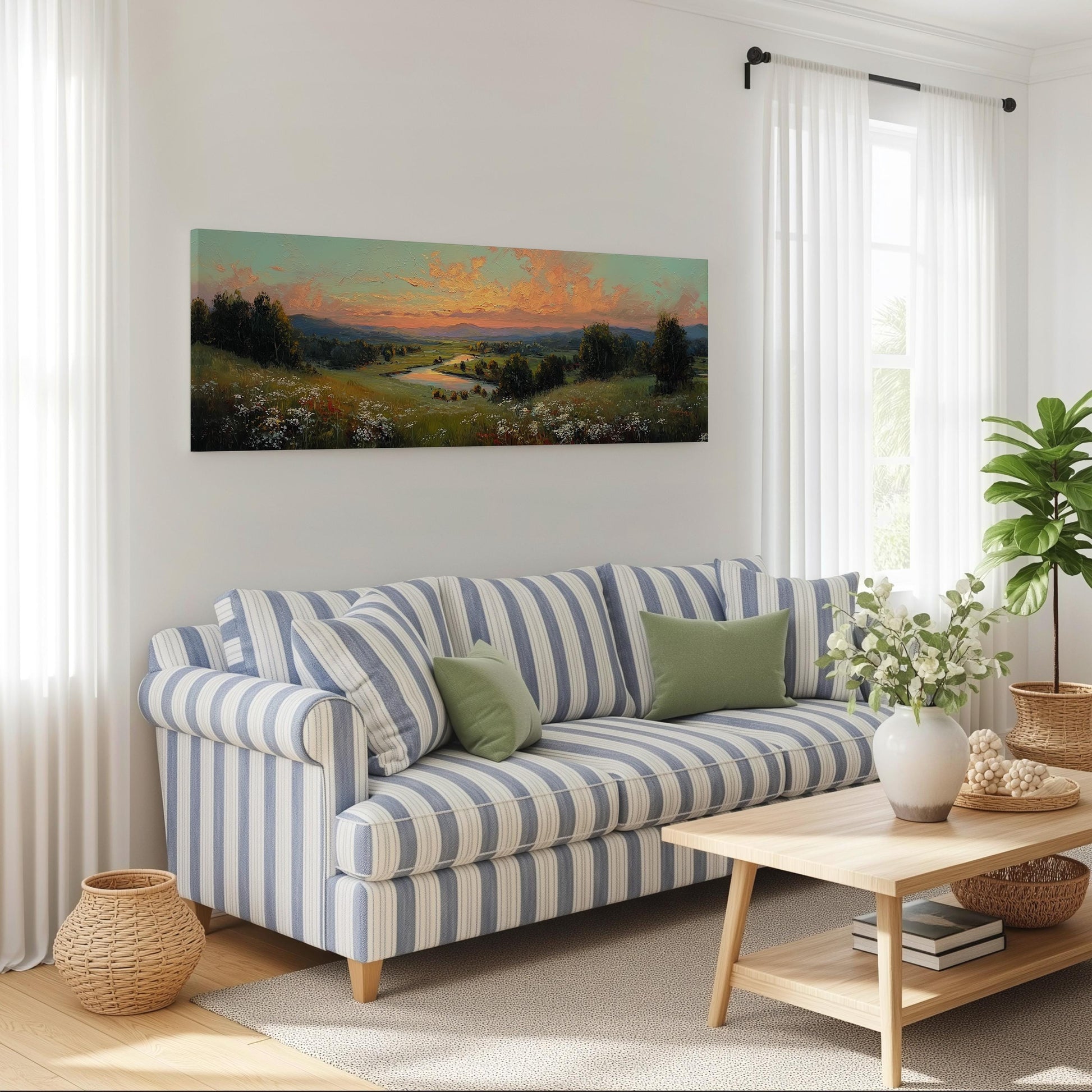 a cozy living room with a striped blue and white sofa, a wooden coffee table, and a large landscape painting hanging on the wall above the sofa.
