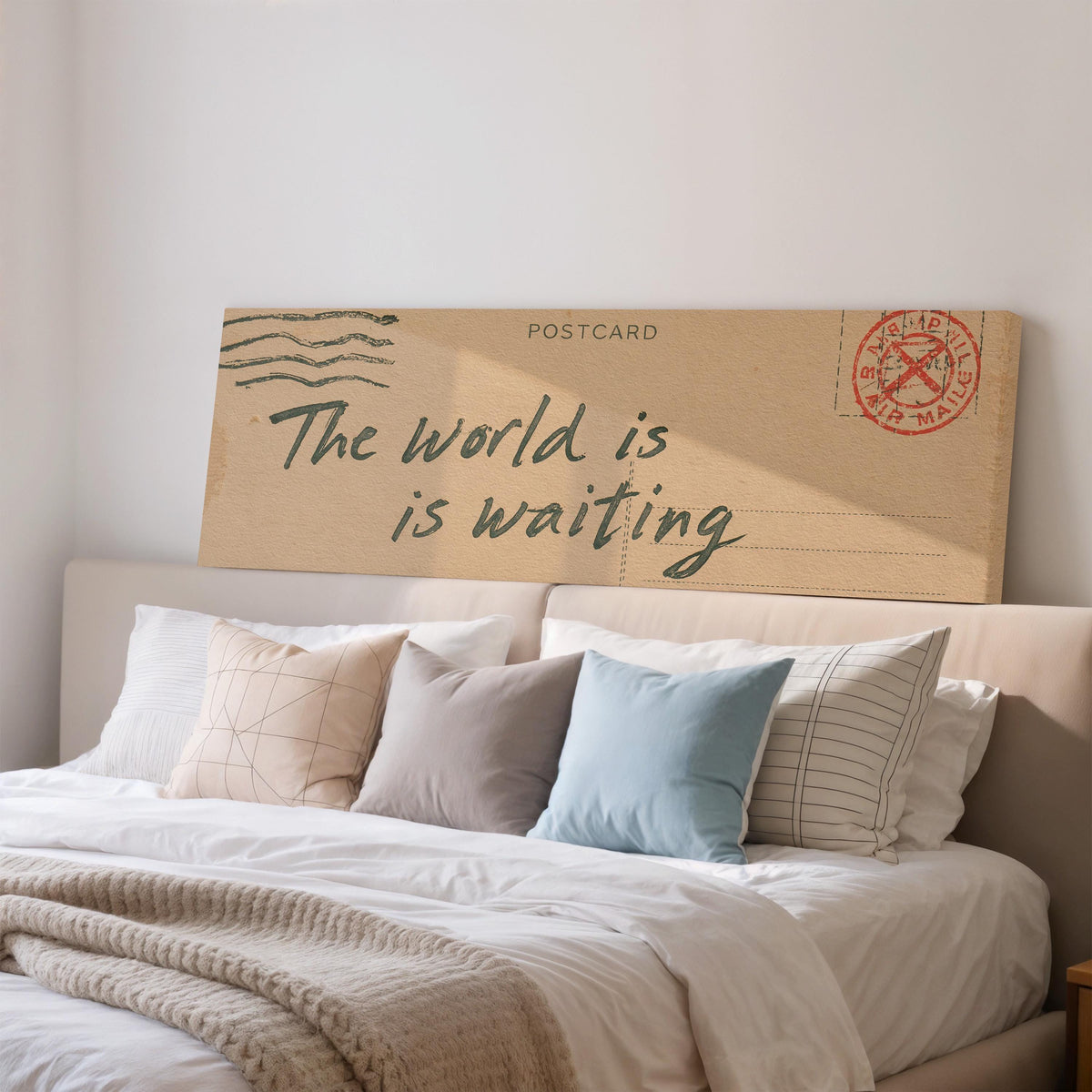 Vintage postcard saying the world is waiting wide panoramic canvas print above a bed in a bedroom