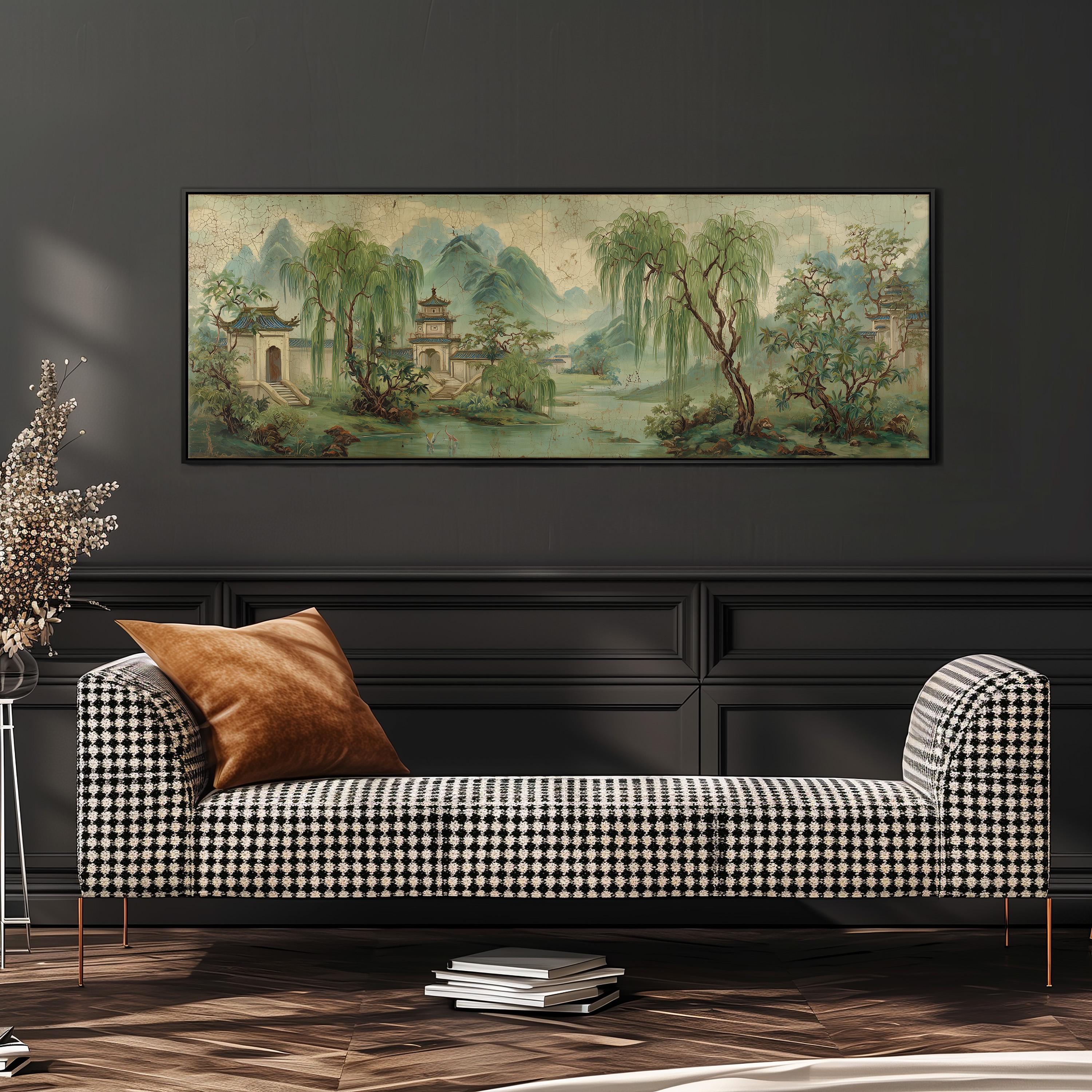 a large, colorful painting of a serene landscape hanging on a wall above a black and white checkered sofa with a brown throw pillow.