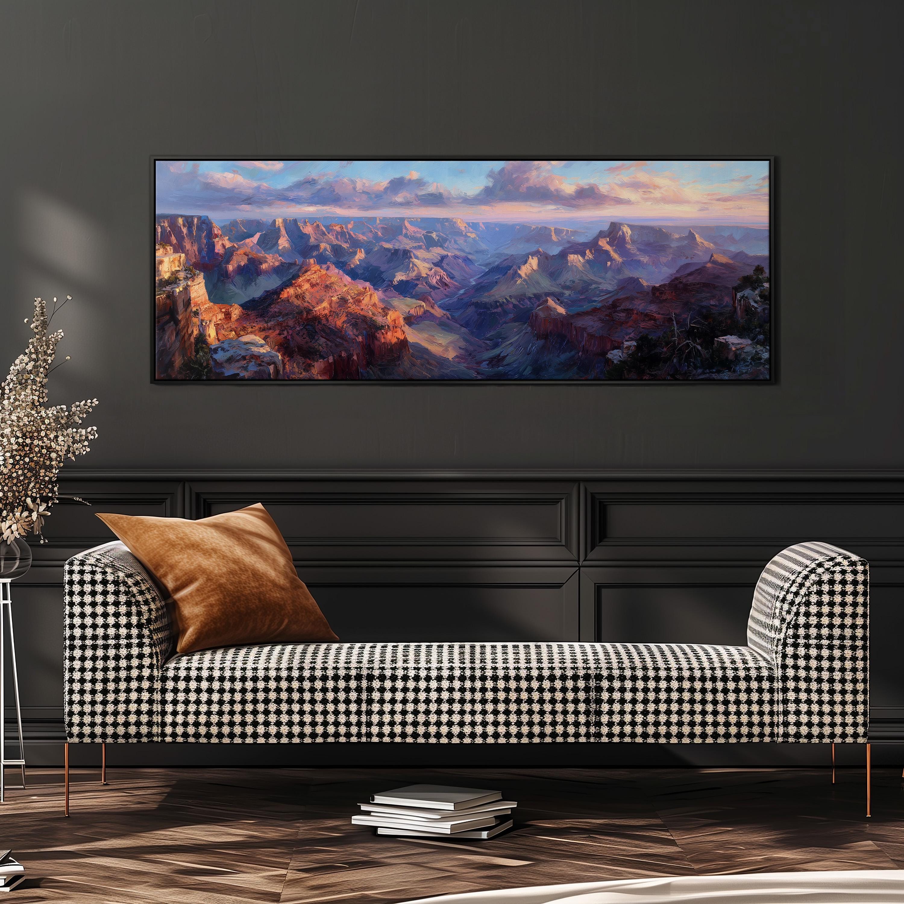 a large, colorful painting of a mountainous landscape hanging on a wall above a black and white checkered sofa in a living room setting.