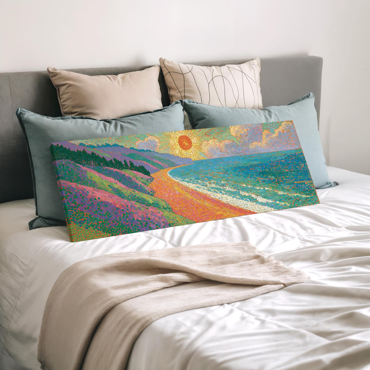 Coastal cliffs at sunset wide panoramic canvas print laid on a bed to show its size