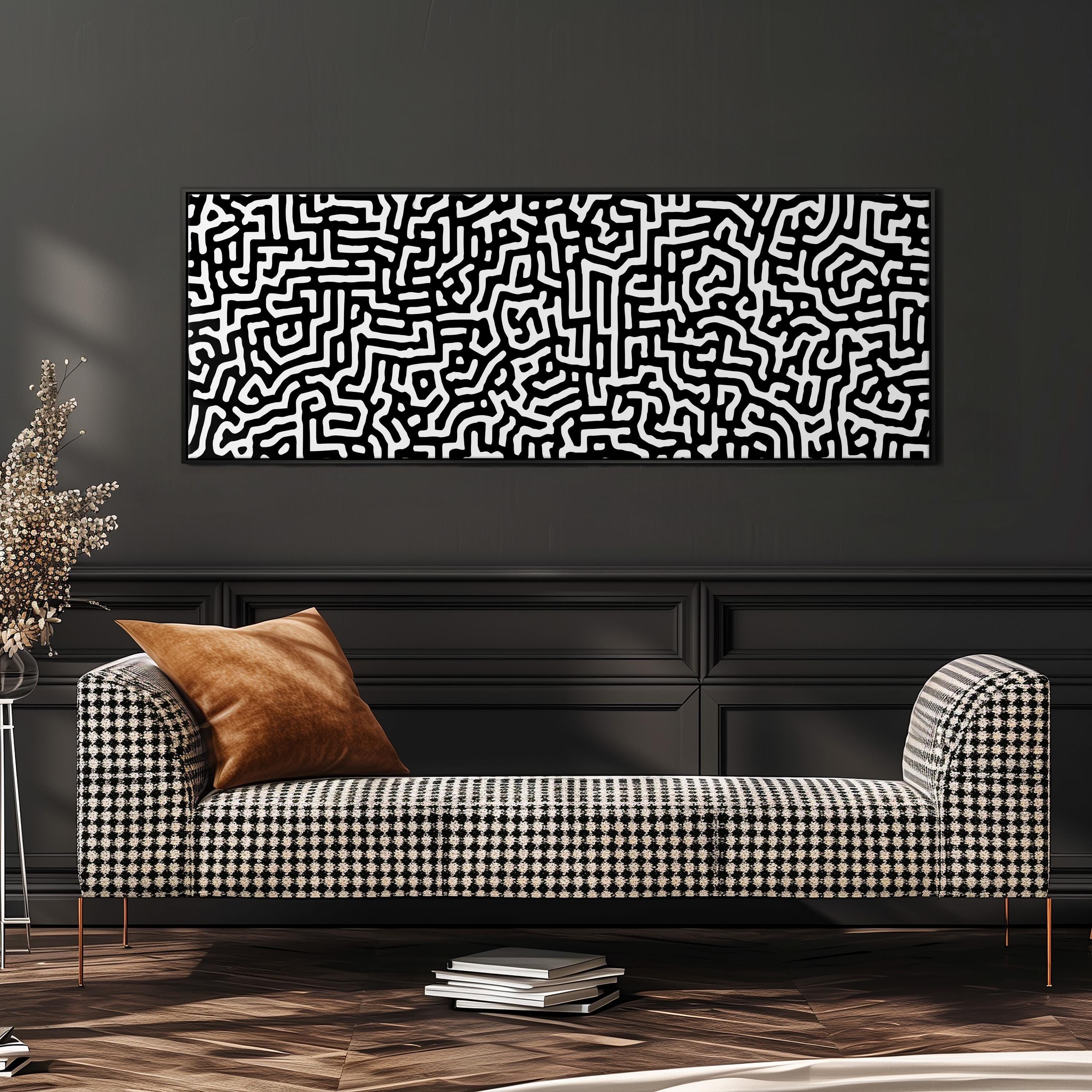 a modern living room with a black and white checkered sofa, a stack of books, and a large abstract painting on the wall.