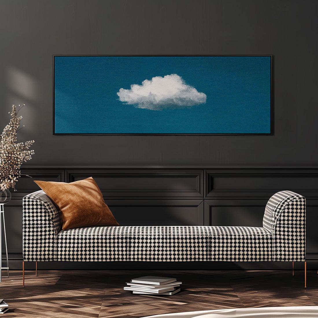 a black and white checkered sofa with a brown throw pillow, set against a dark wall with a framed image of a cloud above it.
