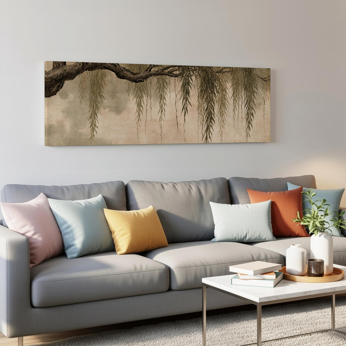 Hanging willow branches panoramic canvas print above a grey sofa in a living room