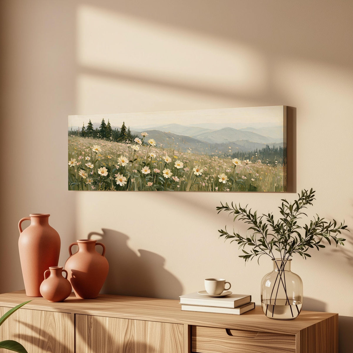 Daisy hillside below blue mountains long horizontal canvas print above a wooden sideboard