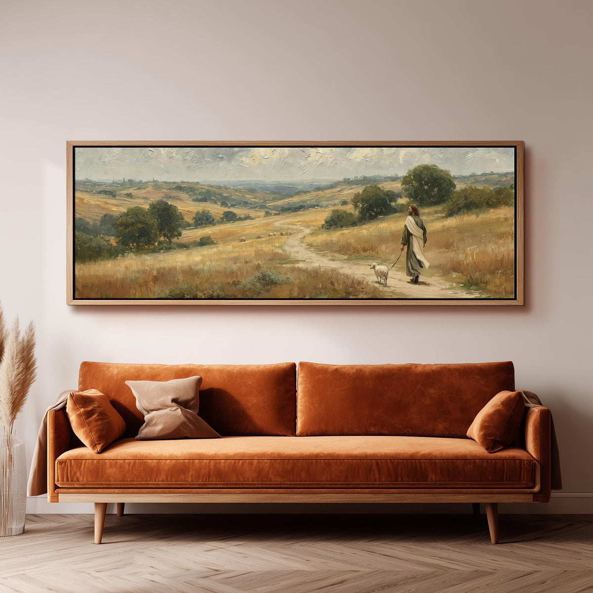 Jesus walking with a sheep on a golden hillside panoramic canvas print above a sofa in a living room