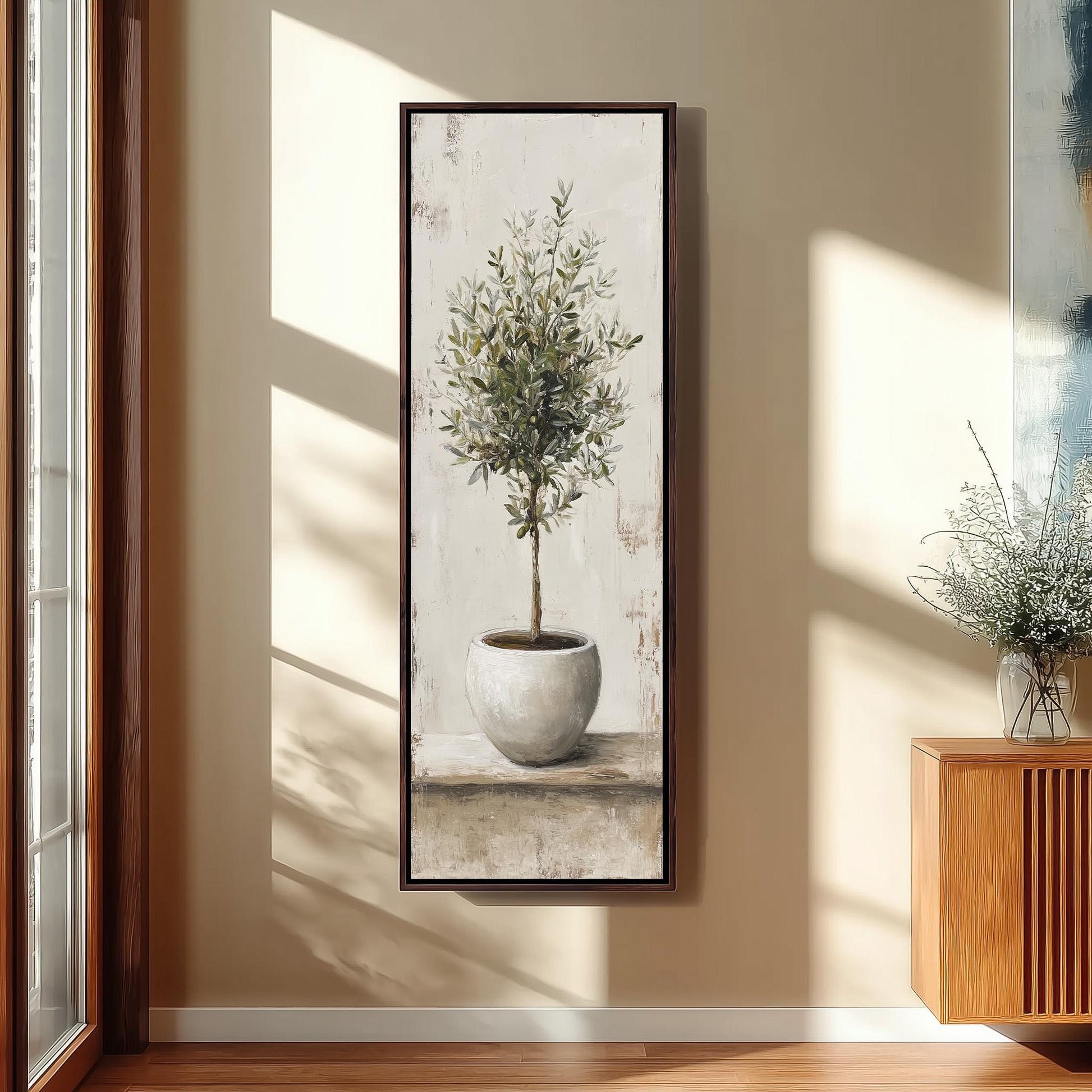 a large painting of a tree in a white pot hanging on a wall.