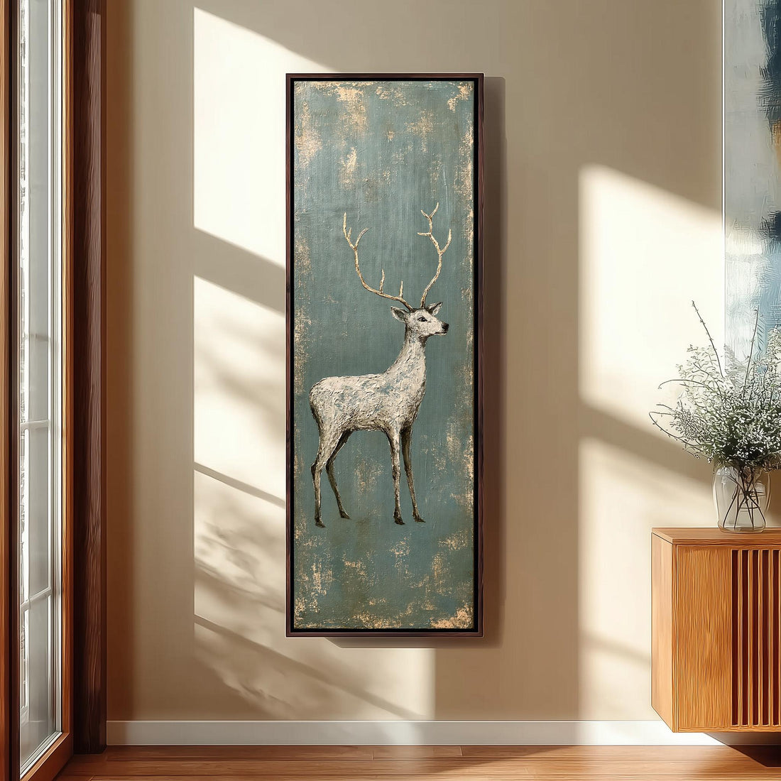 Pale stag with gold antlers on distressed teal long vertical canvas print in a sunlit living space