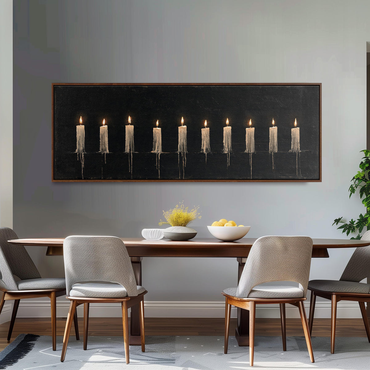 Ten lit candles on black long horizontal canvas print above a dining table