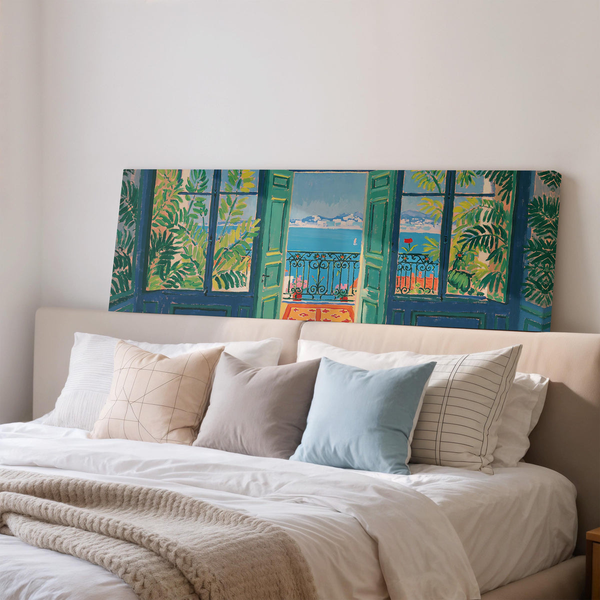 Riviera balcony view through open windows wide panoramic canvas print above a bed in a bedroom