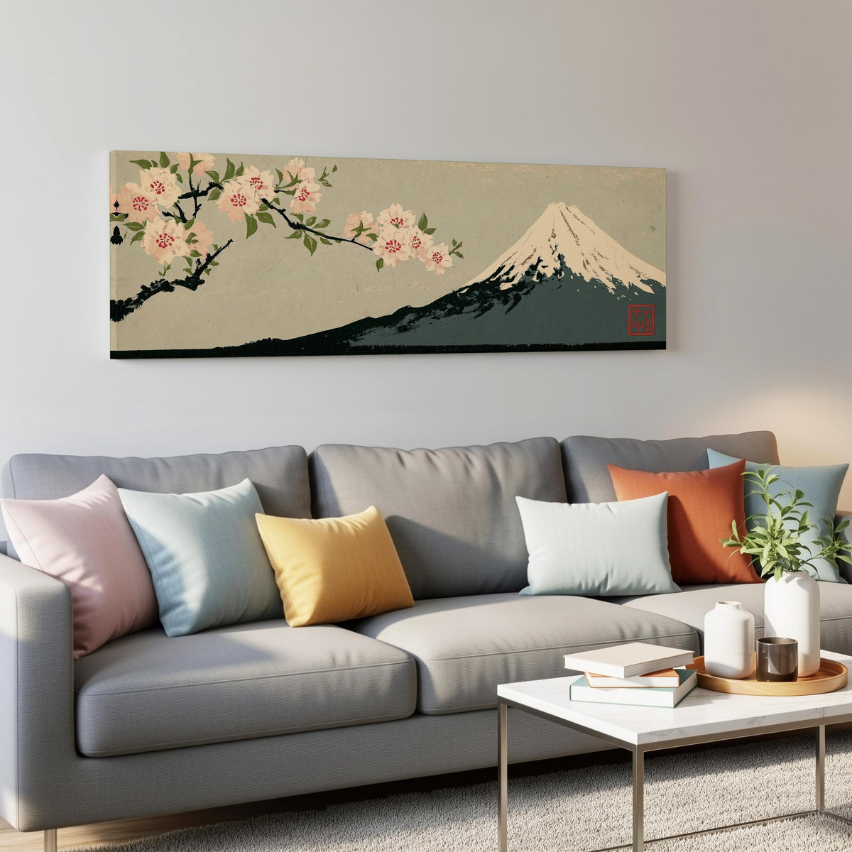 Cherry blossom branch and Mount Fuji panoramic canvas print above a grey sofa in a living room