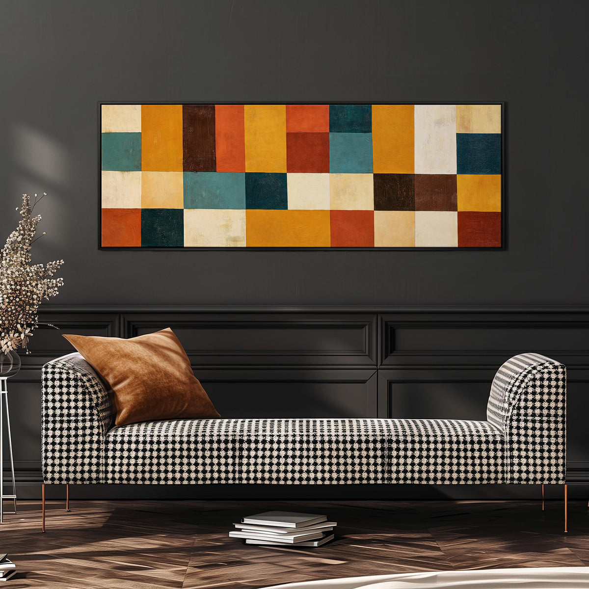 Ochre, rust and teal patchwork blocks wide panoramic canvas print above a bench in a dark living room