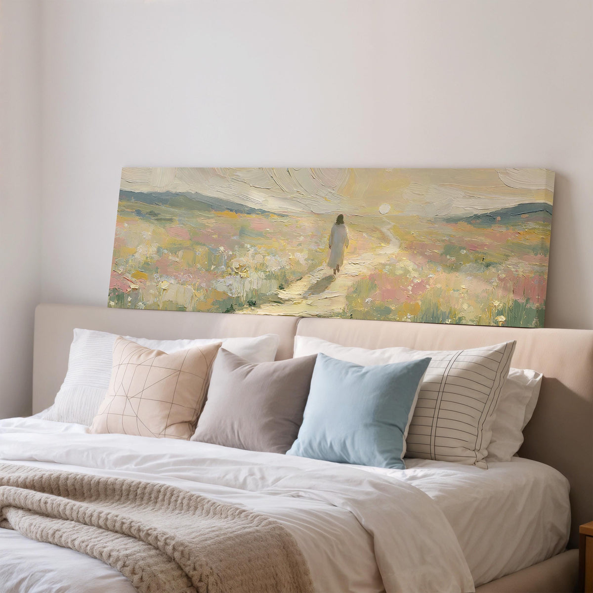 Jesus walking a pastel meadow path wide panoramic canvas print above a bed in a bedroom
