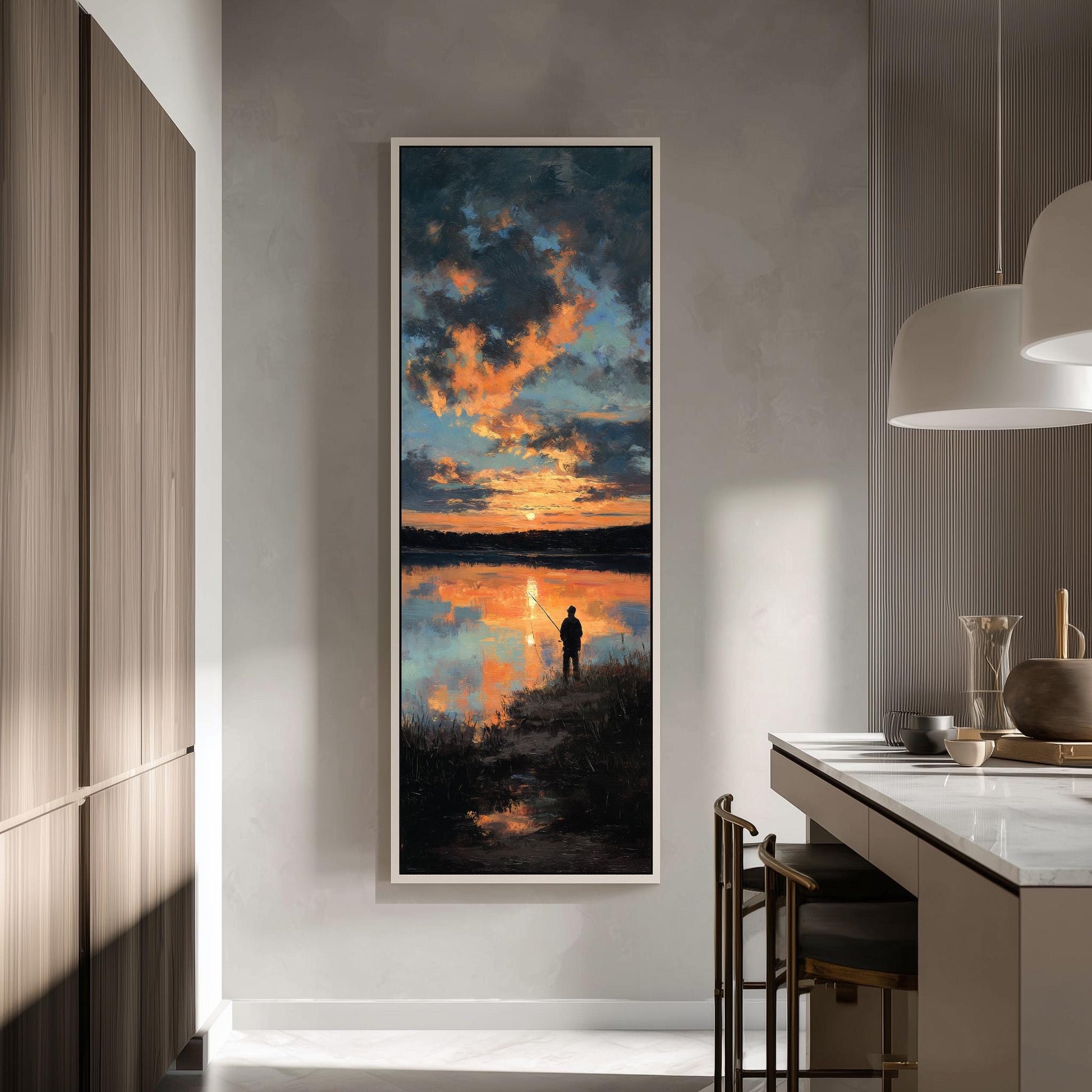 a large framed painting of a serene landscape depicting a person fishing at sunset.