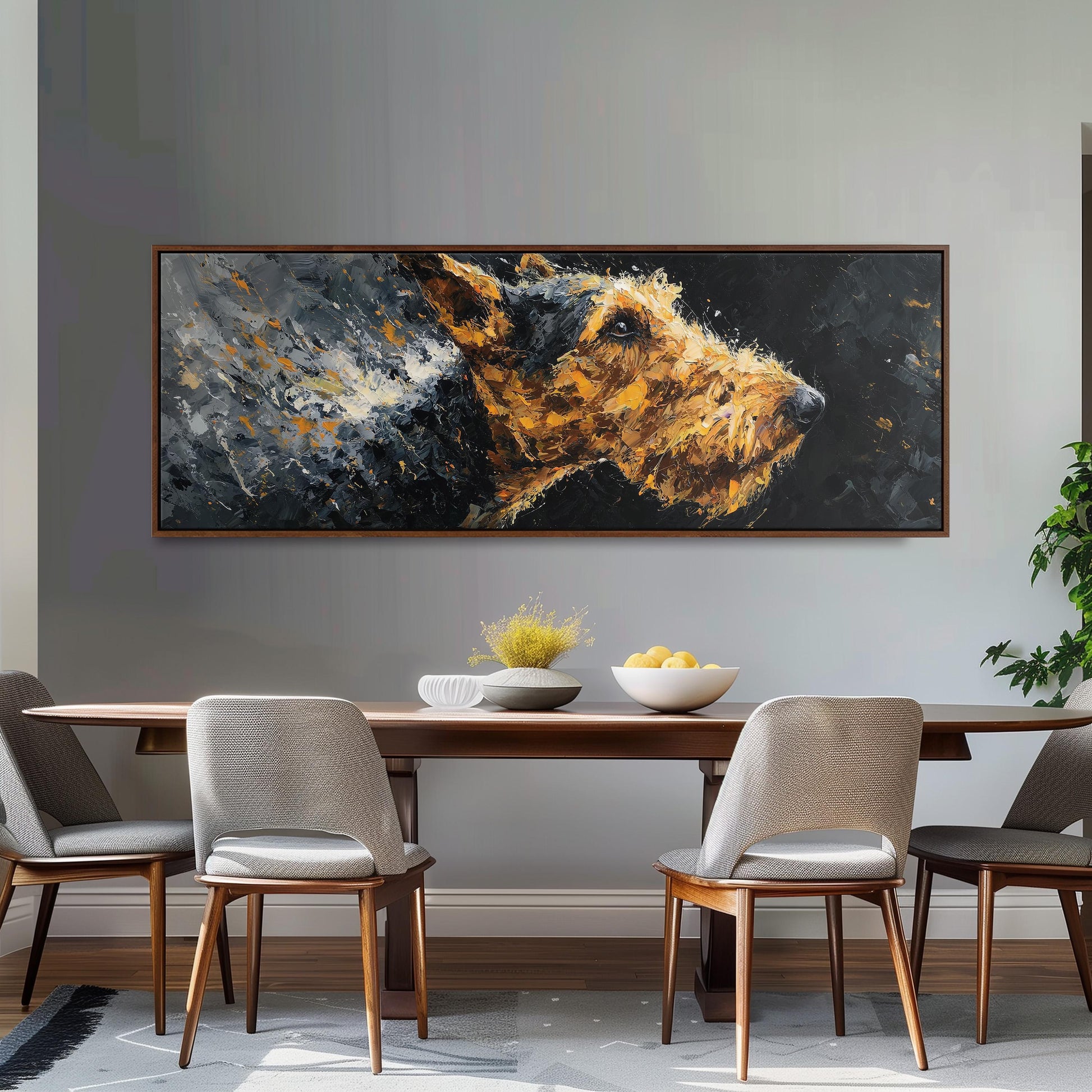 a large painting of a dog's face hanging on a wall above a wooden dining table with four chairs. The table is set with a bowl of fruit and a vase of flowers, creating a cozy and inviting atmosphere.