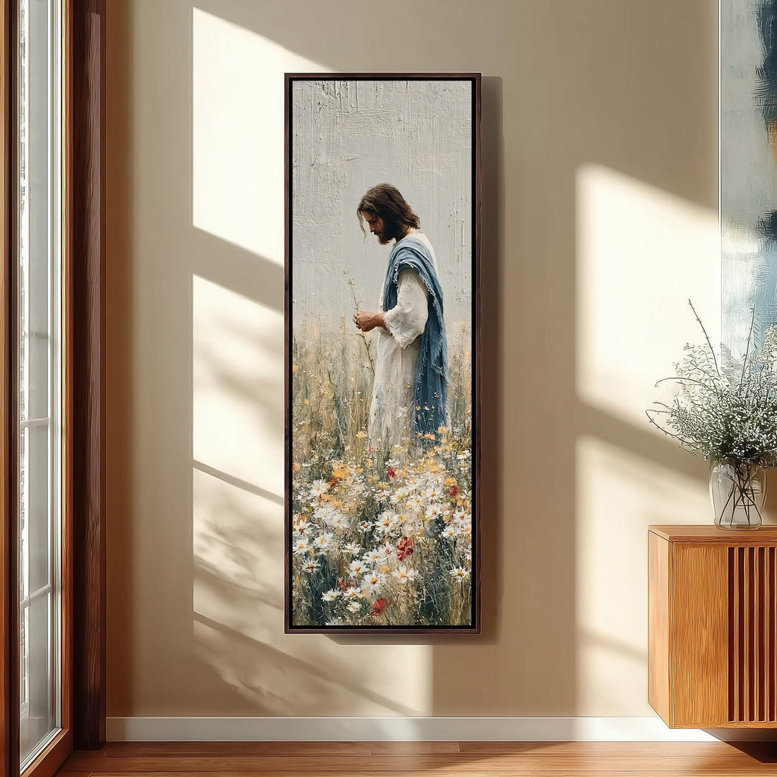 Jesus picking wildflowers in a field long vertical canvas print in a sunlit living space