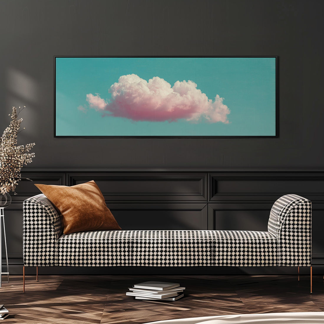 a large framed picture of a cloud with pink and white colors, hanging on a wall above a brown sofa.