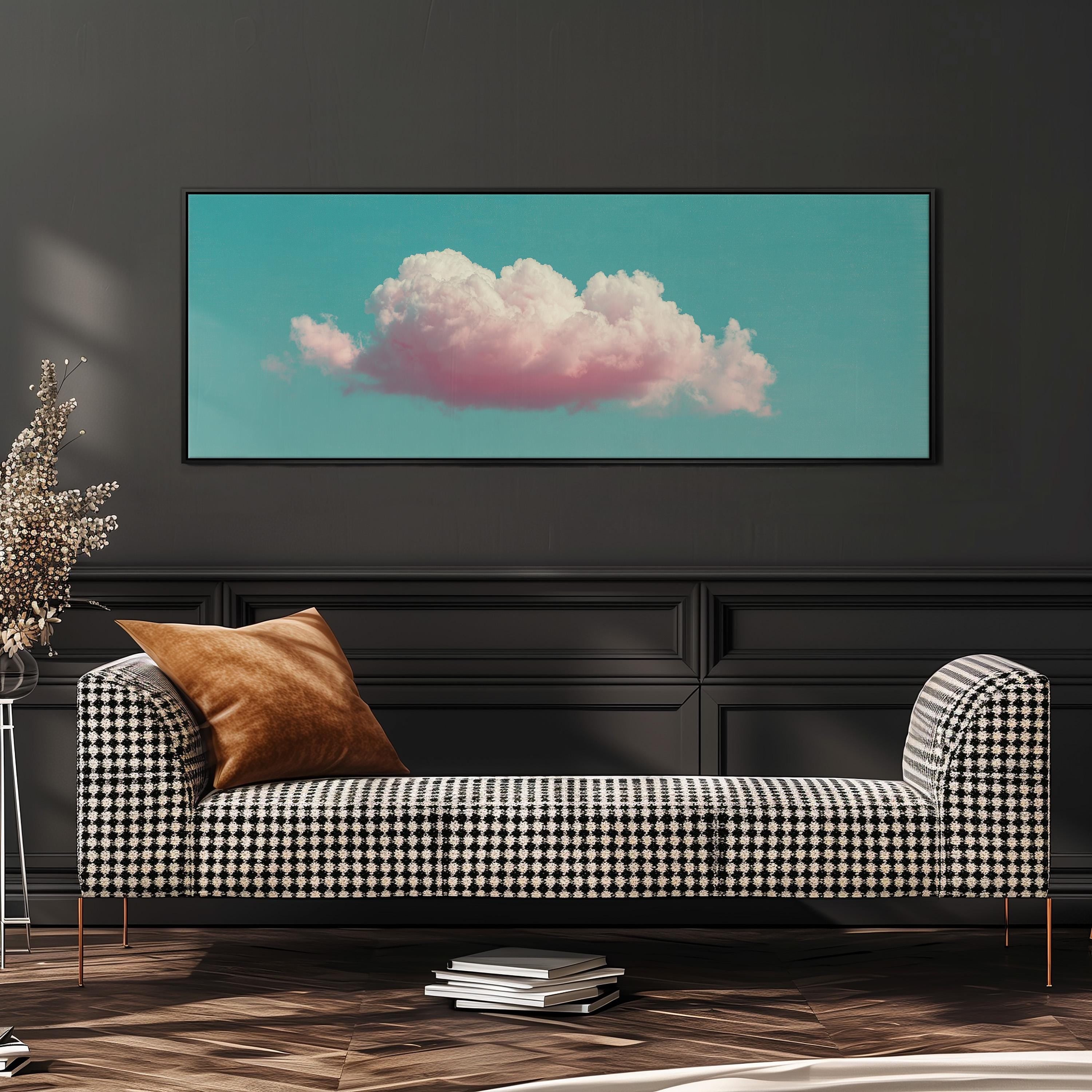a checkered sofa with a brown throw pillow, set against a dark wall with a framed picture of a cloud above it.