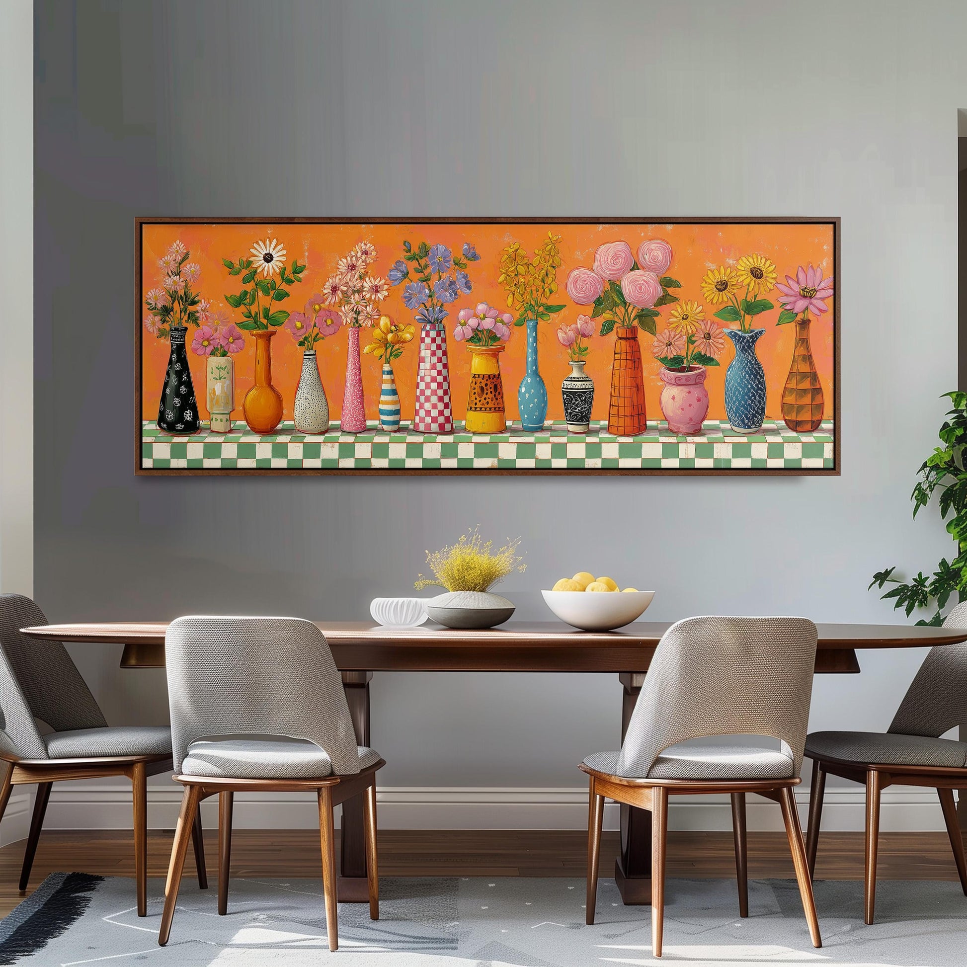 a dining room with a wooden table and four chairs. Above the table, there is a large painting depicting a row of colorful vases filled with flowers.