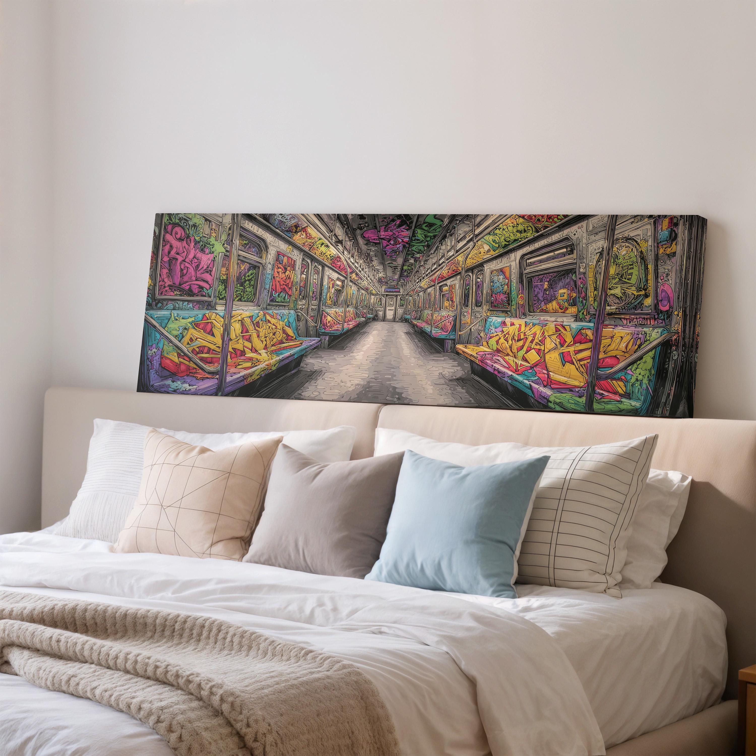 a large, colorful painting of a subway car hanging above a bed with white bedding and pillows.
