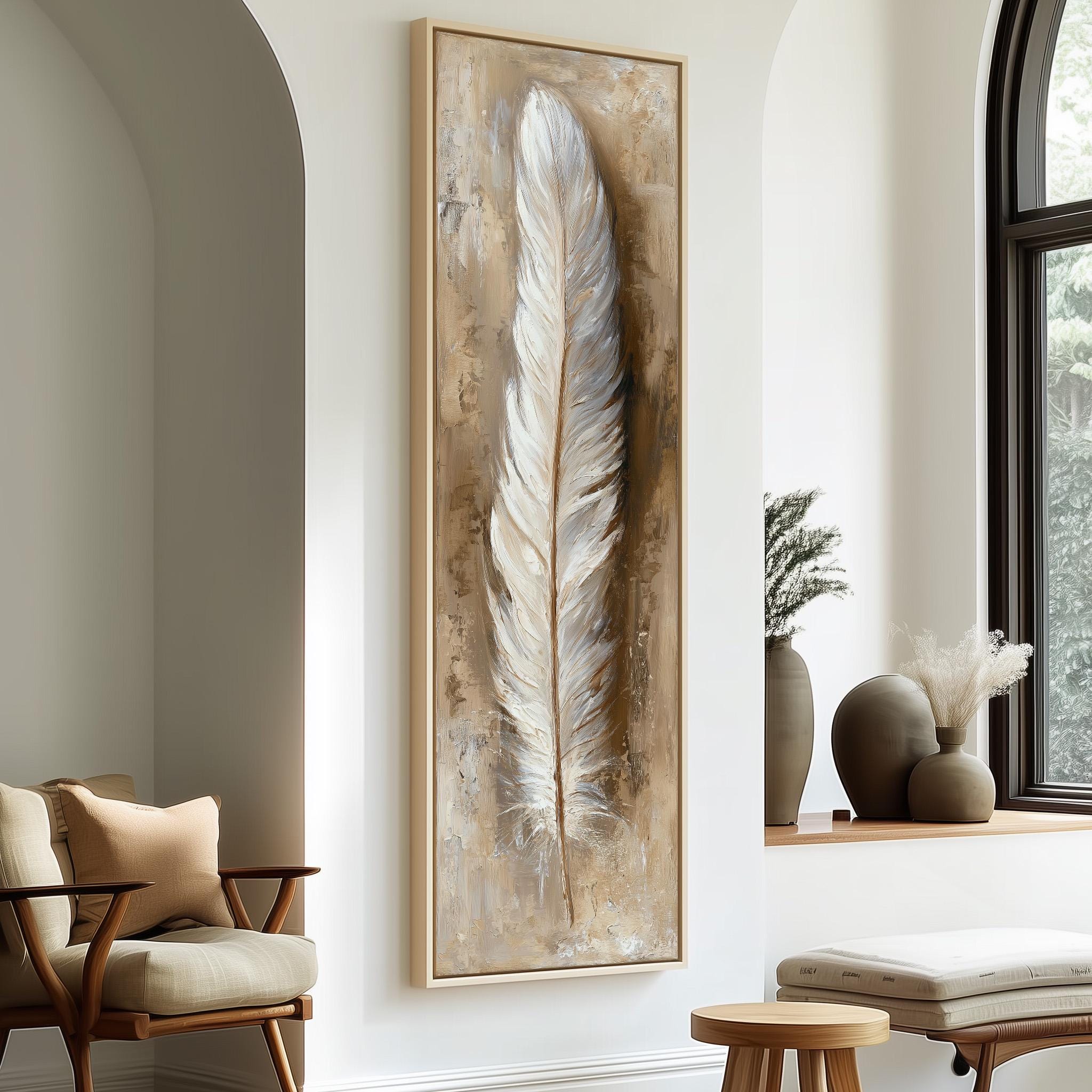 a large framed painting of a feather hanging on a wall, with a wooden chair and a small table in the foreground.
