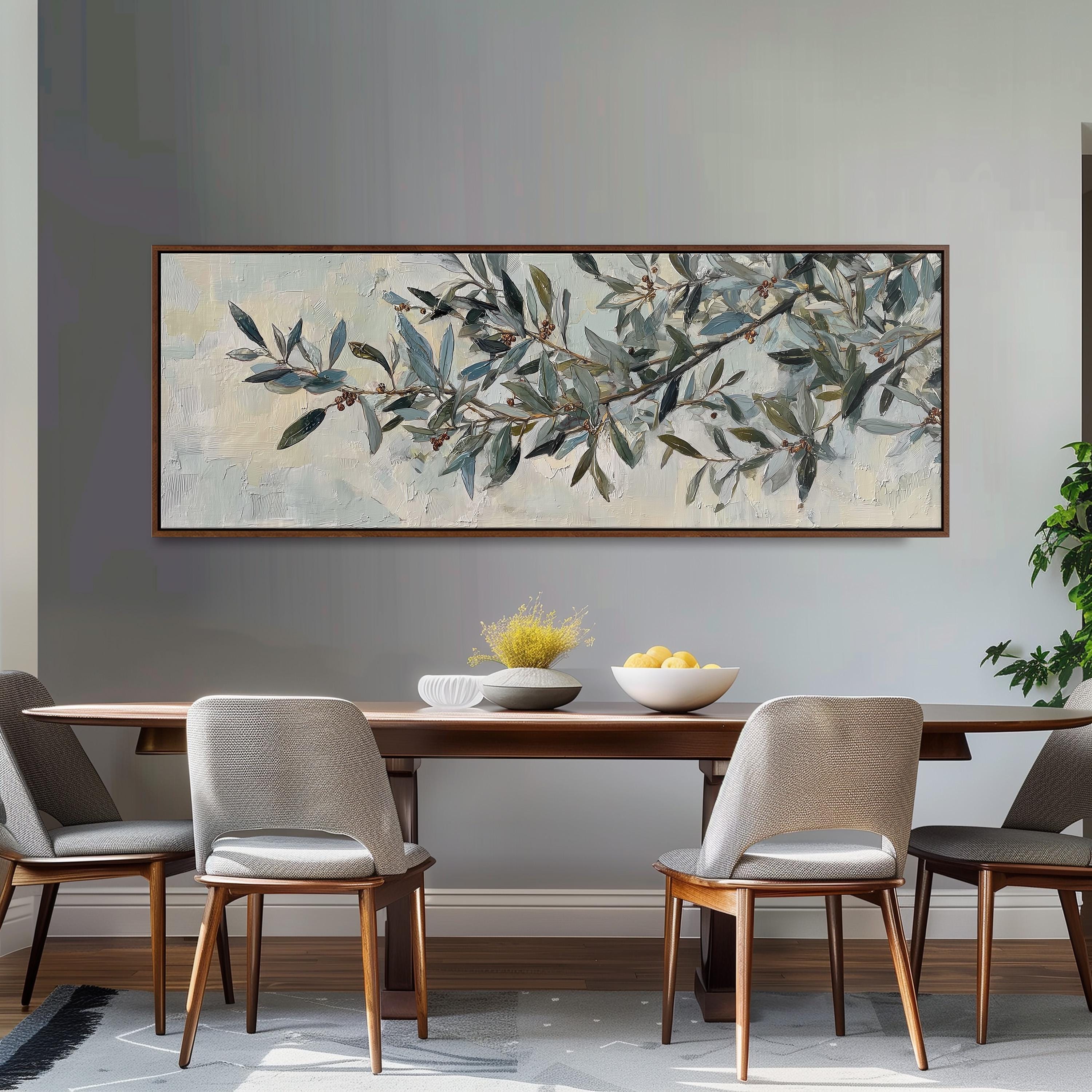 a dining room with a large painting of an olive tree hanging on the wall above a wooden dining table with four chairs. The table is set with a bowl of fruit and a vase of flowers, creating a cozy and inviting atmosphere.