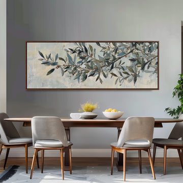 a dining room with a large painting of an olive tree hanging on the wall above a wooden dining table with four chairs. The table is set with a bowl of fruit and a vase of flowers, creating a cozy and inviting atmosphere.