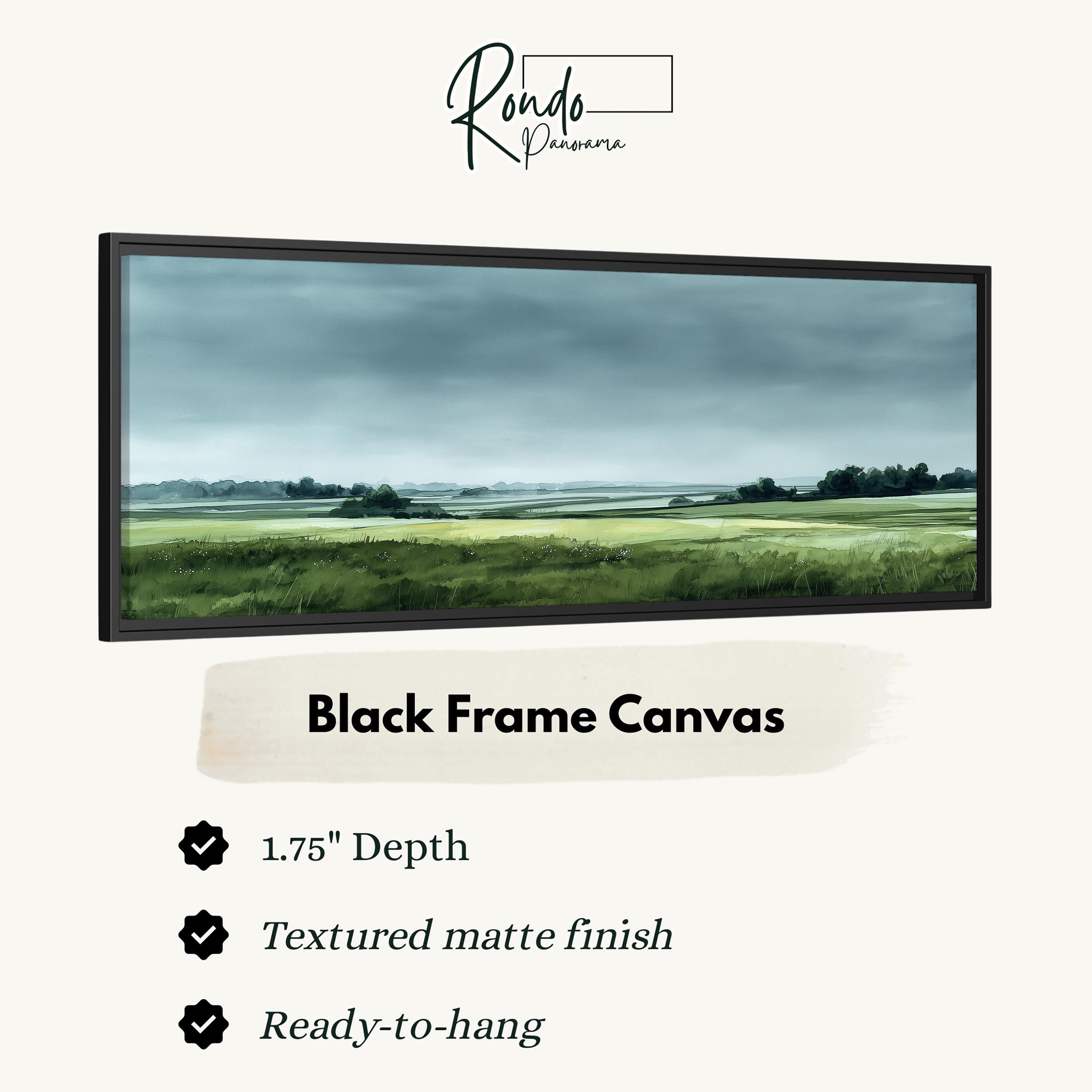 The image is a black frame canvas depicting a serene landscape with a field and trees under a cloudy sky.