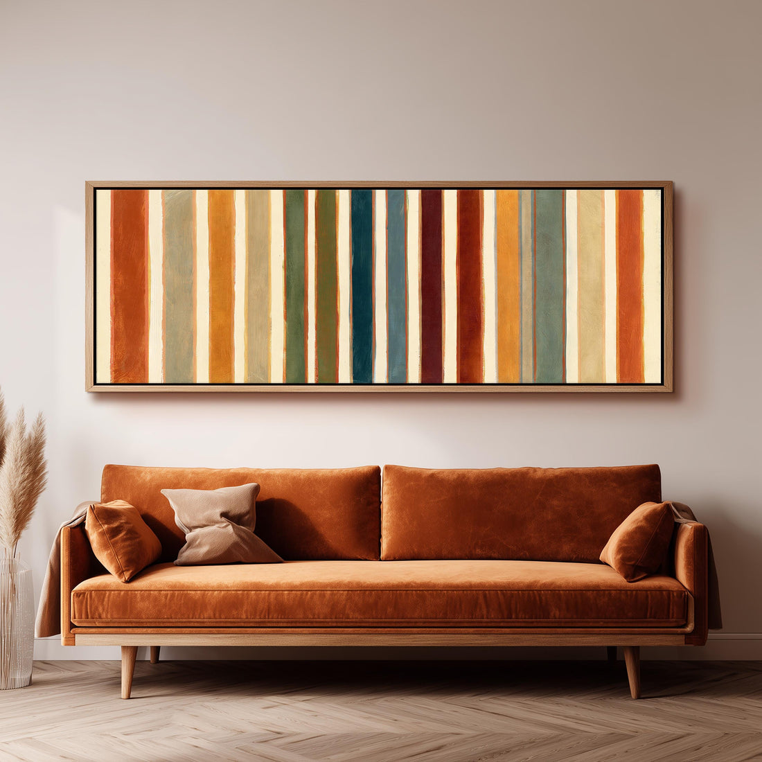 Rust, sage, maroon and teal stripes long horizontal canvas print above a sofa in a living room
