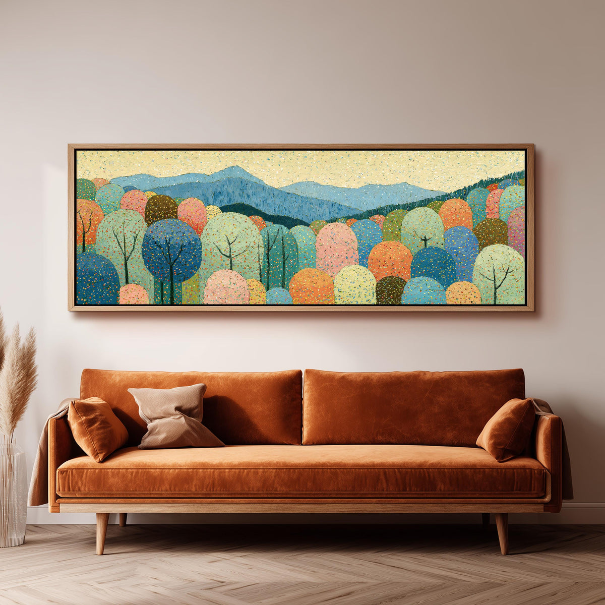 Pastel dotted forest below blue mountains panoramic canvas print above a sofa in a living room