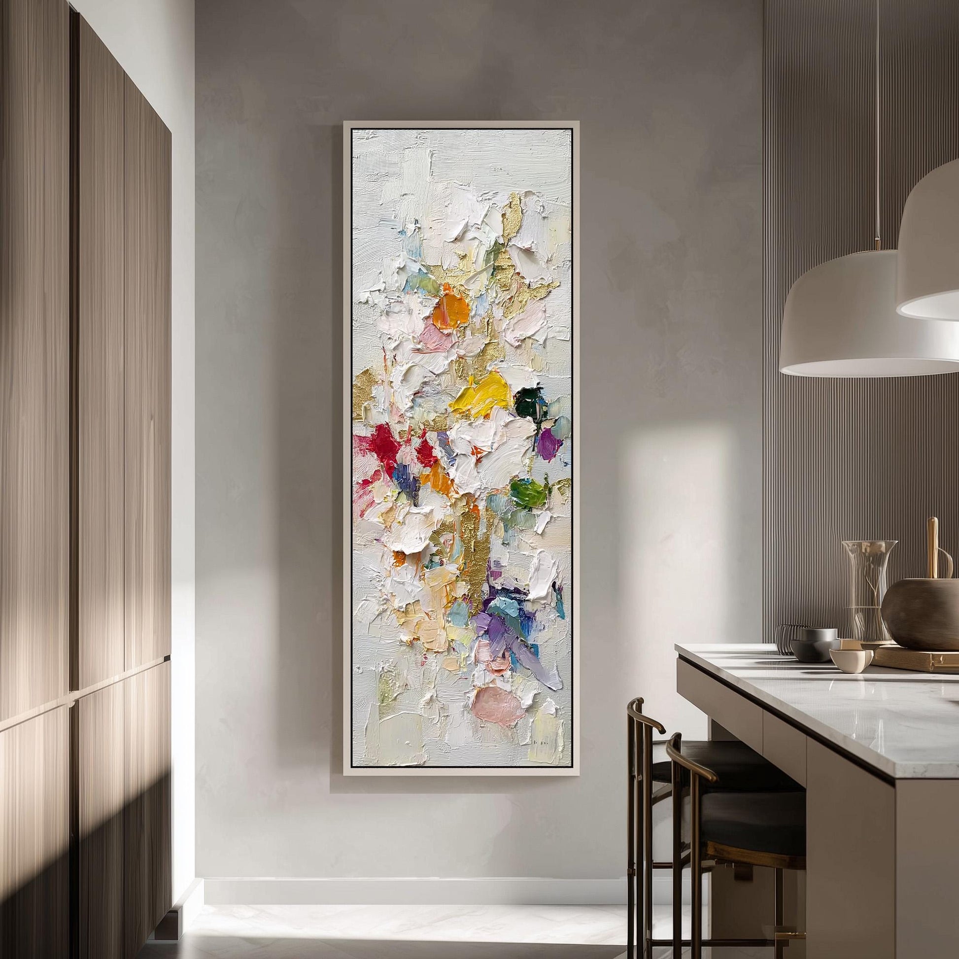 a large, colorful painting hanging on a wall in a modern kitchen.